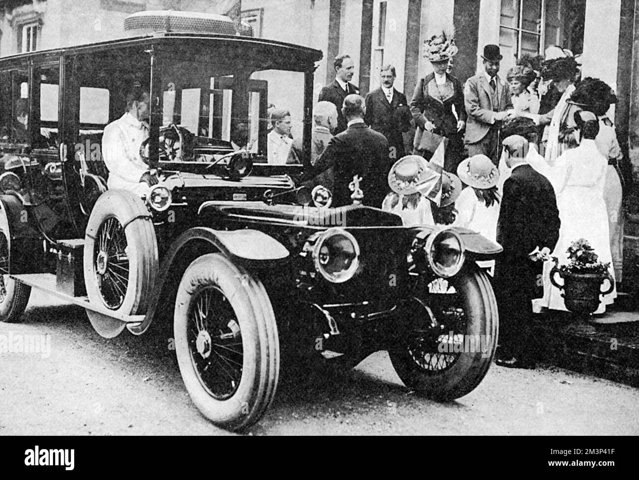 King George V and Queen Mary about to enter their Daimler car during a visit to Yorkshire in July 1912.     Date: 1912 Stock Photo