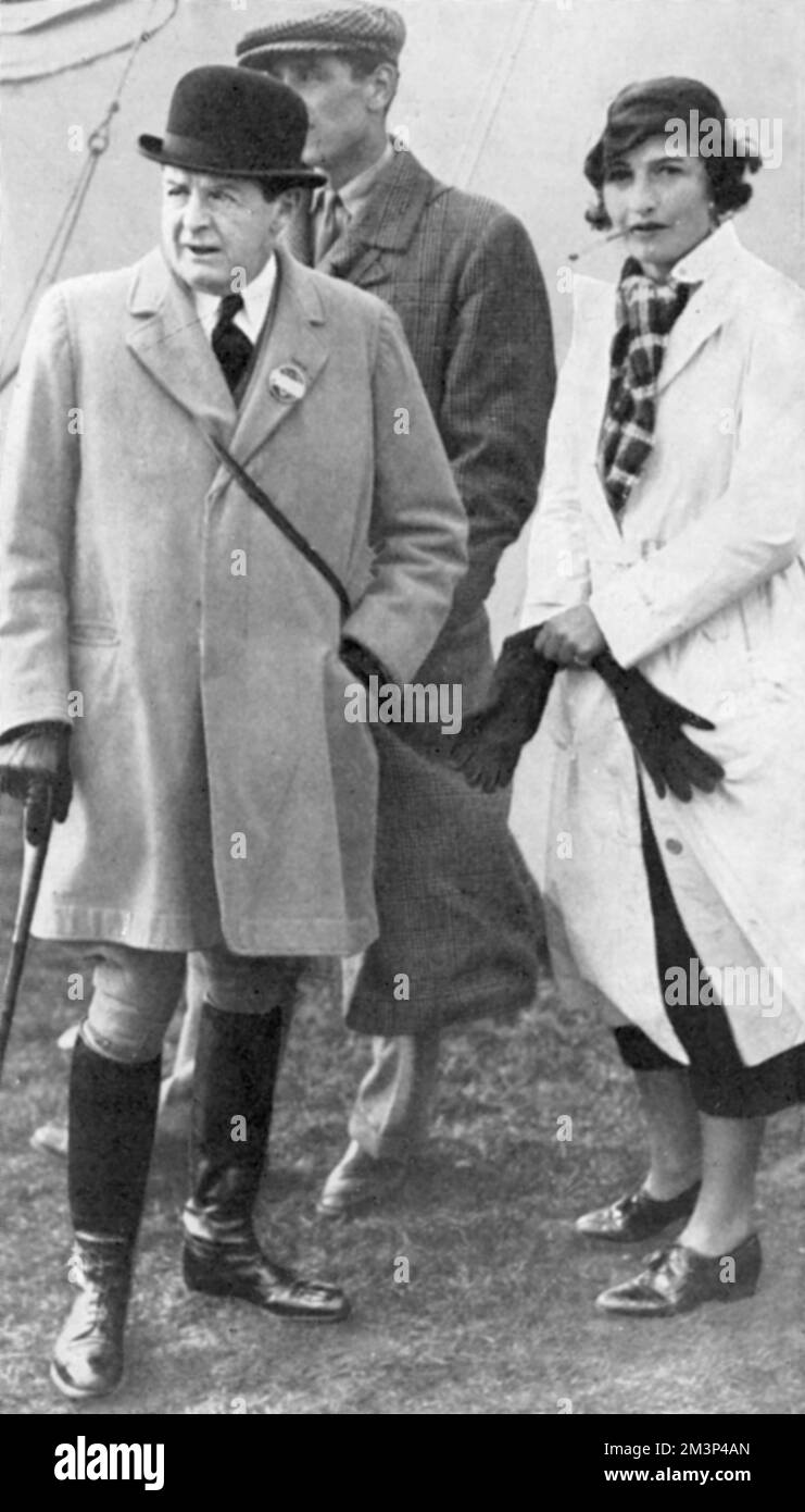 Admiral Lord Beatty and Mrs Ronald Tree (better known now as Nancy Lancaster) at the Woodland Pytchley Hunt. Nancy Lancaster (1897 - 1994), nee Perkins, was an influential American-born tastemaker, interior decorator and garden designer. She married Ronald Tree (joint master of the Pytchley hunt and later MP for Harborough) in 1920, moving to Britain in 1927; the couple divorced in 1947 and she married Claude Lancaster in 1948. She was associated with the English Country House Style.     Date: 1934 Stock Photo