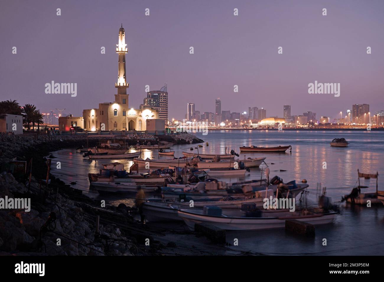 Hanan Kanoo Mosque and Bahrain skyline, Al Ghous Hwy, Muharraq, Bahrain Stock Photo