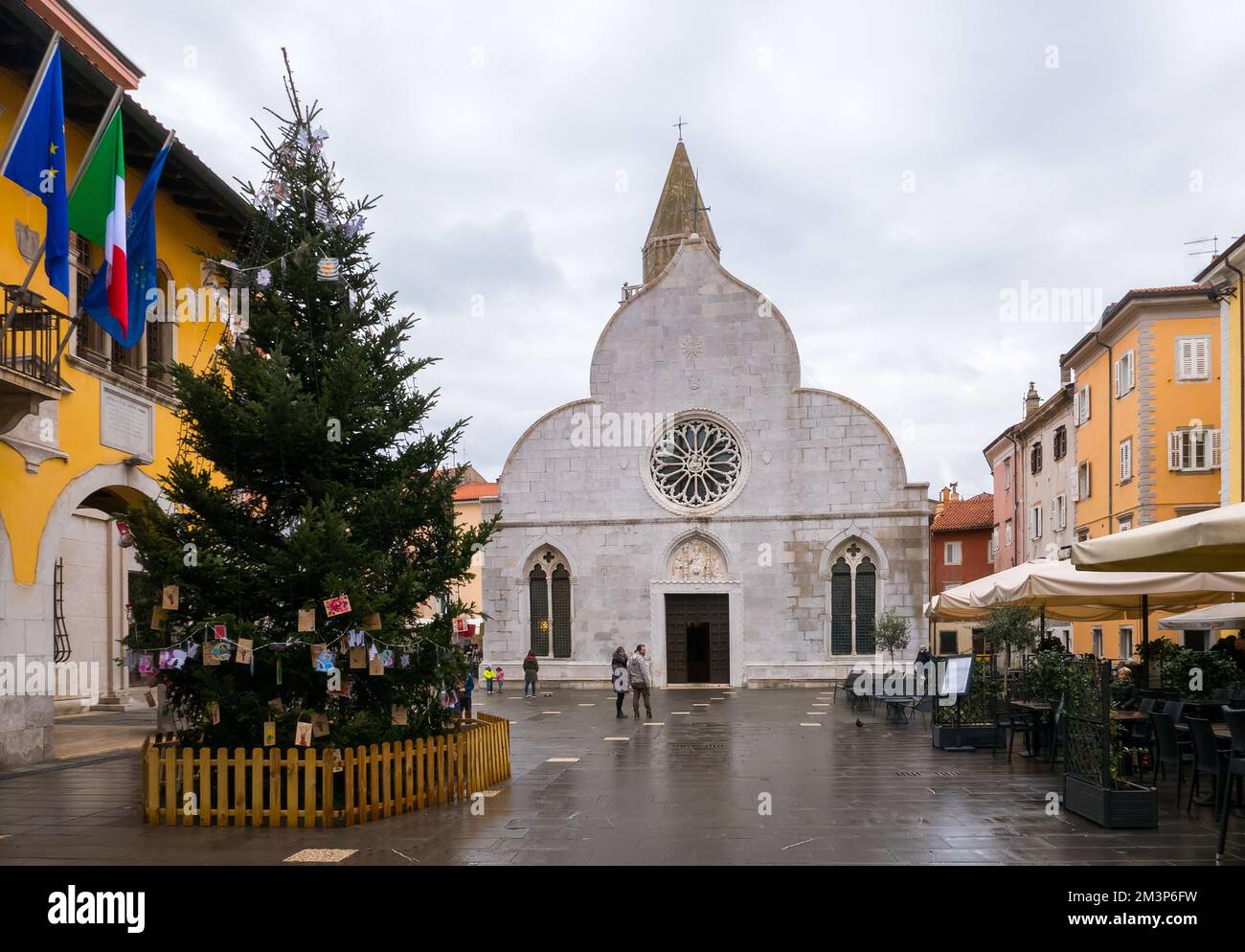 Muggia, Italy (8th December 2022) - The antique church of Saints John and Paul (santi Giovanni e Paolo) in central Piazza Marconi Square Stock Photo