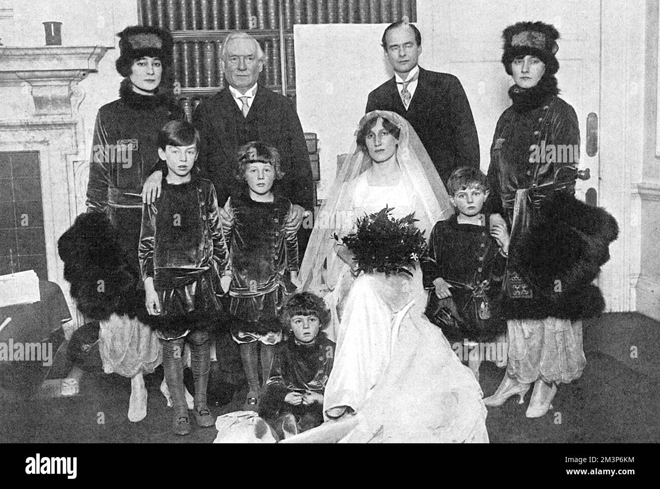 Wedding group at the marriage of Violet Asquith to Maurice Bonham-Carter.  Helen Violet Bonham Carter, Baroness Asquith of Yarnbury, DBE (15 April 1887  19 February 1969) was a British politician and diarist. She was the daughter of H. H. Asquith, Prime Minister from 19081916, and later became active in Liberal politics herself, being a leading opponent of appeasement, standing for Parliament and being made a life peer. She was also involved in arts and literature. Her illuminating diaries cover her father's premiership before and during World War I and continue until the 1960s.  She was a clo Stock Photo
