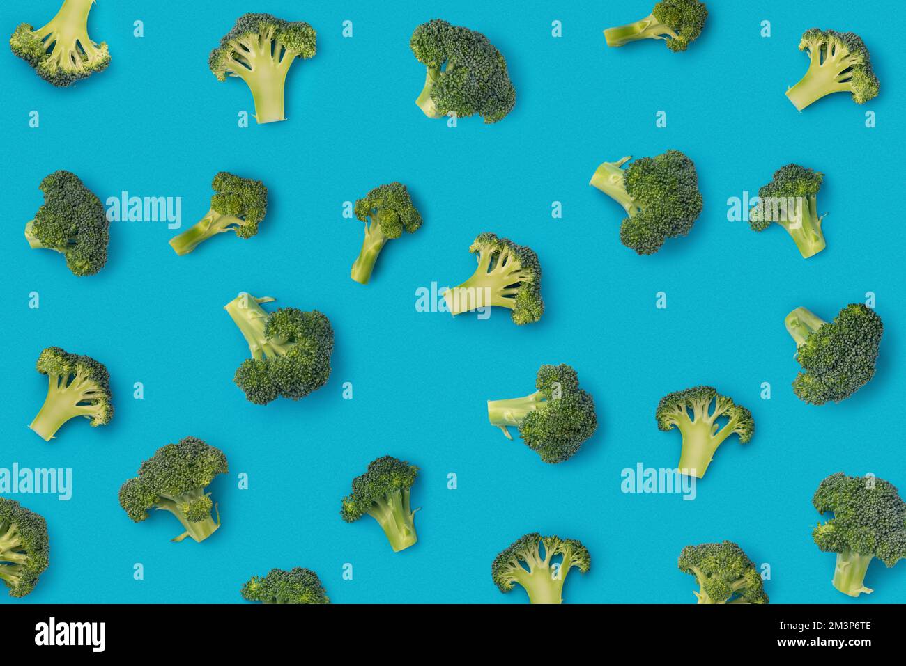 Pattern with broccoli on a blue background Stock Photo