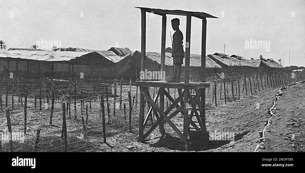 An Indian sentry guarding the Turkish prisoners' camp in Mesopotamia during the First World War.       Date: 1916 Stock Photo