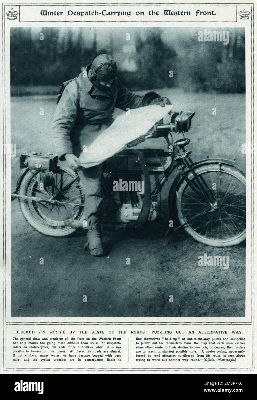 Corporal Newsham, a British Press despatch rider, studying a map on his motorcycle at Rollancourt in northern France during the First World War.  Blocked EN ROUTE by the state of the roads:  Puzzling out an alternative way.  The general thaw and break-up of the frost on the Western Front not only made the going more difficult than usual for despatch riders on motor bikes, but in some places the roads were entirely under water, or had become bogged with deep mire, and the cyclist orderlies are in consequence liable to find themselves held up, out of the way points and compelled to puzzle a map Stock Photo