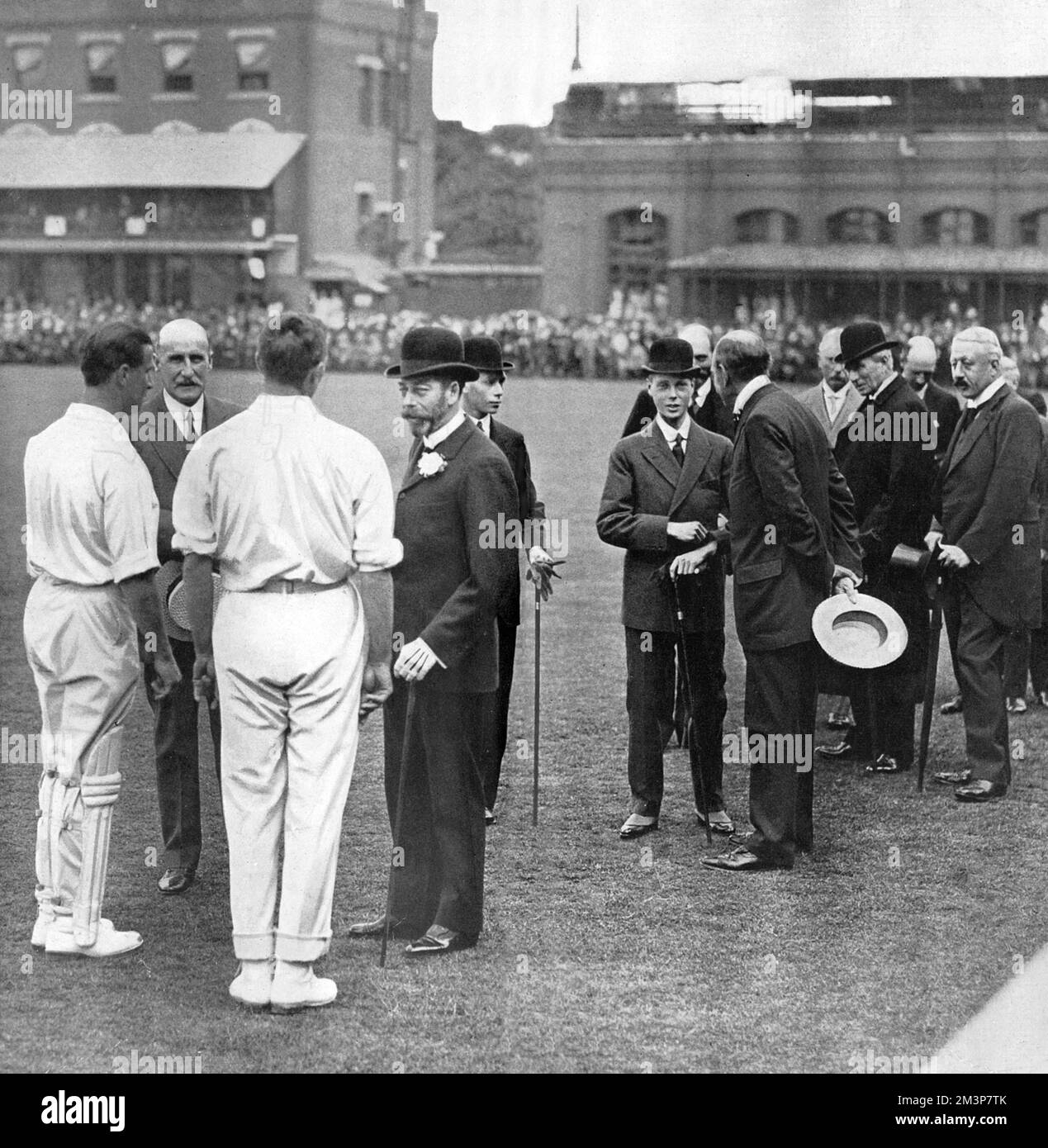 King George V and Edward, Prince of Wales (later King Edward VIII and then Duke of Windsor), pictured at Lord's cricket ground where its centenary was being celebrated in June 1914.  The occasion was marked by a match between M.C.C. South African heroes and the Rest of England.  The King is pictured chatting to Mr C. B. Fry, Mr Johnny Douglas and Lord Hawke.  Prince Albert (later King George VI) is seen just behind the King, and the Prince of Wales is talking to Mr F. E. Lacey.  On the right are Sir C. Cust and the Duke of Devonshire.     Date: 1914 Stock Photo