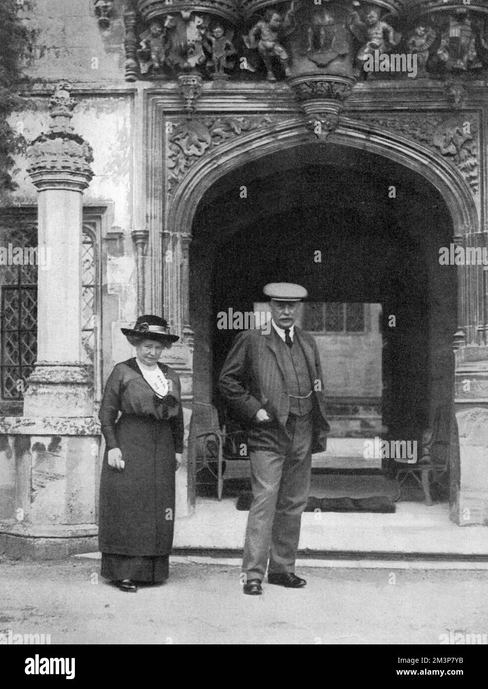 Lieutenant Colonel and the Hon. Mrs Wood outside the wonderful porch of Hengrave Hall, near Bury St. Edmunds in Suffolk.  The hall was converted into a complete hospital for wounded soldiers.  As The Tatler says, 'Situated in one of the most beautiful parts of the country...Hengrave Hall lends itself admirably to the purpose of convalescence.'     Date: 1914 Stock Photo