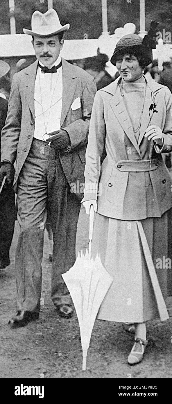 King Manuel of Portugal, who spent most of his exile in England, together with his wife, Queen Augusta (formerly Princess Augustine Victoria of Hohenzollern), pictured at the Chelsea Flower Show in 1916.     Date: 1916 Stock Photo