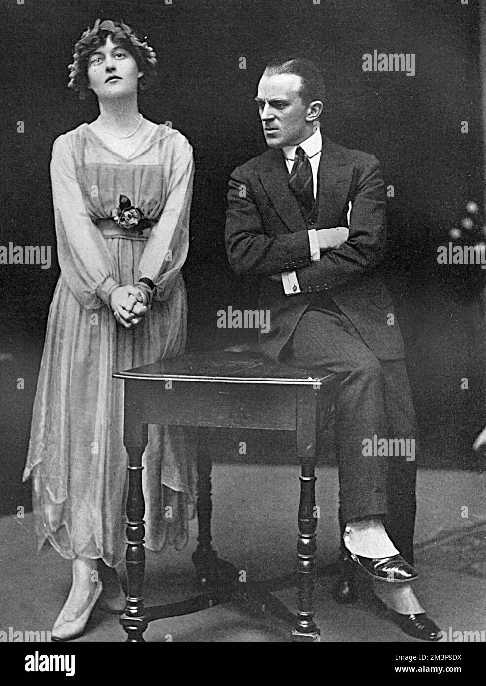 Miss Elizabeth Asquith rehearsing with Mr Nelson Keys for their sketch in the forthcoming Serbian Relief Fund Matinee to be held on 9 May 1916 and organised by Lady Greville and Lady Oranmore and Browne.  Elizabeth Charlotte Lucy Asquith (1897-1945), later Princess Bibesco was an English writer, the daughter of British Prime Minister Herbert Asquith and his second wife, Margot. She married Prince Antoine Bibesco, a Romanian diplomat in 1920.  She was actively involved in fundraising activities during the First World War, particularly anything theatrical as she was a keen amateur actress and or Stock Photo