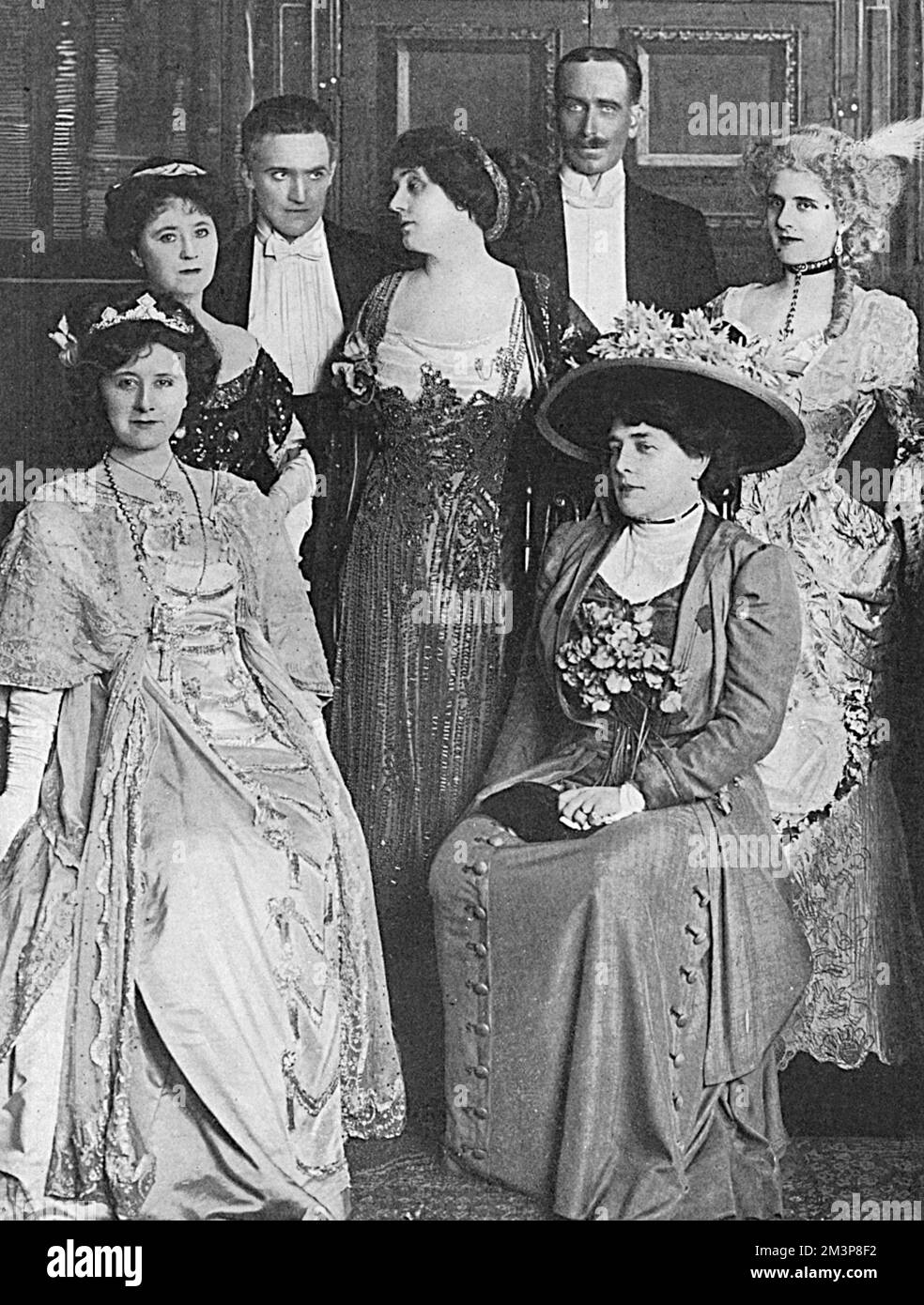 An interesting photograph showing the acclaimed stage beauty, Mrs Patrick Campbell (1865-1940), born Beatrice Stellar Tanner (pictured centre), in the same photograph as Mrs George Cornwallis-West (Lady Randolph Churchill, formerly Jennie Jerome, mother of Winston Churchill).  Lady Randolph married George Cornwallis-West, a man twenty years her junior, in 1900.  George began an affair with 'Mrs Pat' around 1909 and he and Jennie separated in 1912.  She reverted to her old title of Lady Randolph Churchill and later married Montagu Porch.  Picture shows the cast of 'His Borrowed Plumes,' a comed Stock Photo