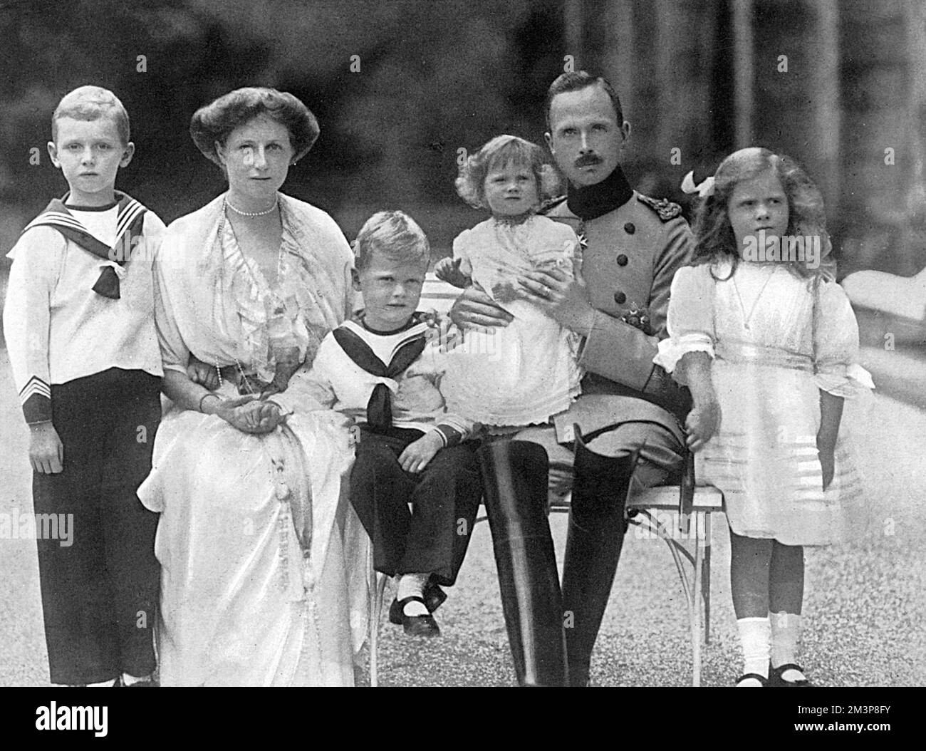 Duke Charles Edward of Saxe-Coburg-Gotha, with the Duchess (Victoria Adelaide) and their family, from left: Prince John Leopold; Prince Hubert; Princess Caroline; Princess Sybil. The grandson of Queen Victoria, and son of the Duke of Albany, Charles Edward faced a conflict of national loyalty as war broke out months after this photograph was taken. Holding a commission in the German army, he chose to support Germany rather than the country of his birth. Stock Photo