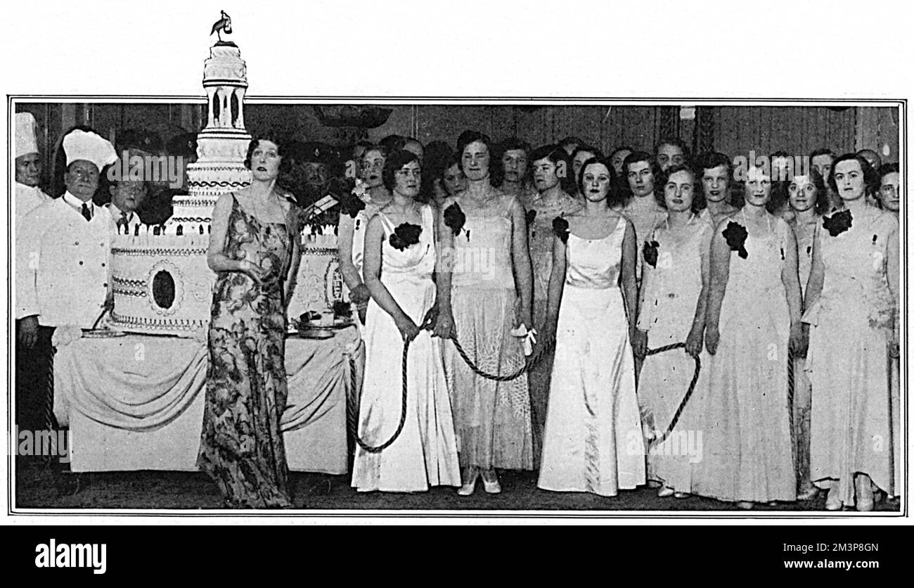 Queen Charlotte's Birthday Ball, held at the May Fair Hotel, to raise funds for the Queen Charlotte Hospital at Hammersmith. Lady Diana Cooper, who was the Dame d'Honneur in this decorative procession, is standing in front of an enormous cake, and included in the group are Miss Rosemary Brassey, Miss Pamela Cayzer, Miss Diane Chamberlain, the Hon. Slyvia Coke, Lady Georgina Curzon, Lady Katherine Fitzmaurice, Miss Joan Madden, Mlle. Lyvia Paravicini, Lady Patricia Moore, the Hon. Angela Greenwood, Miss Helena Perrott, the Hon. Bronwen Scott Ellis, the Hon. Pamela Stanley, and Miss Patricia Wel Stock Photo