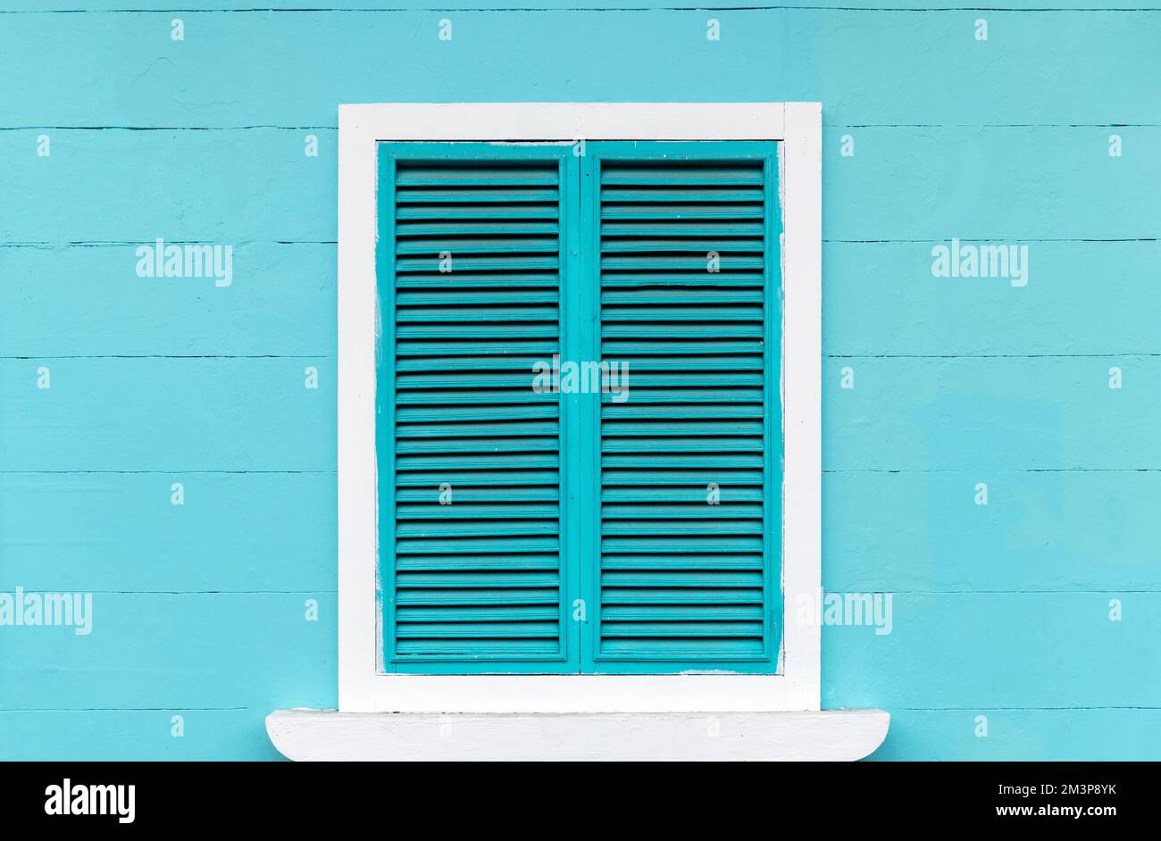 Colonial style turquoise wooden facade with window in Santa Ana Hill, Guayaquil, Ecuador. Stock Photo