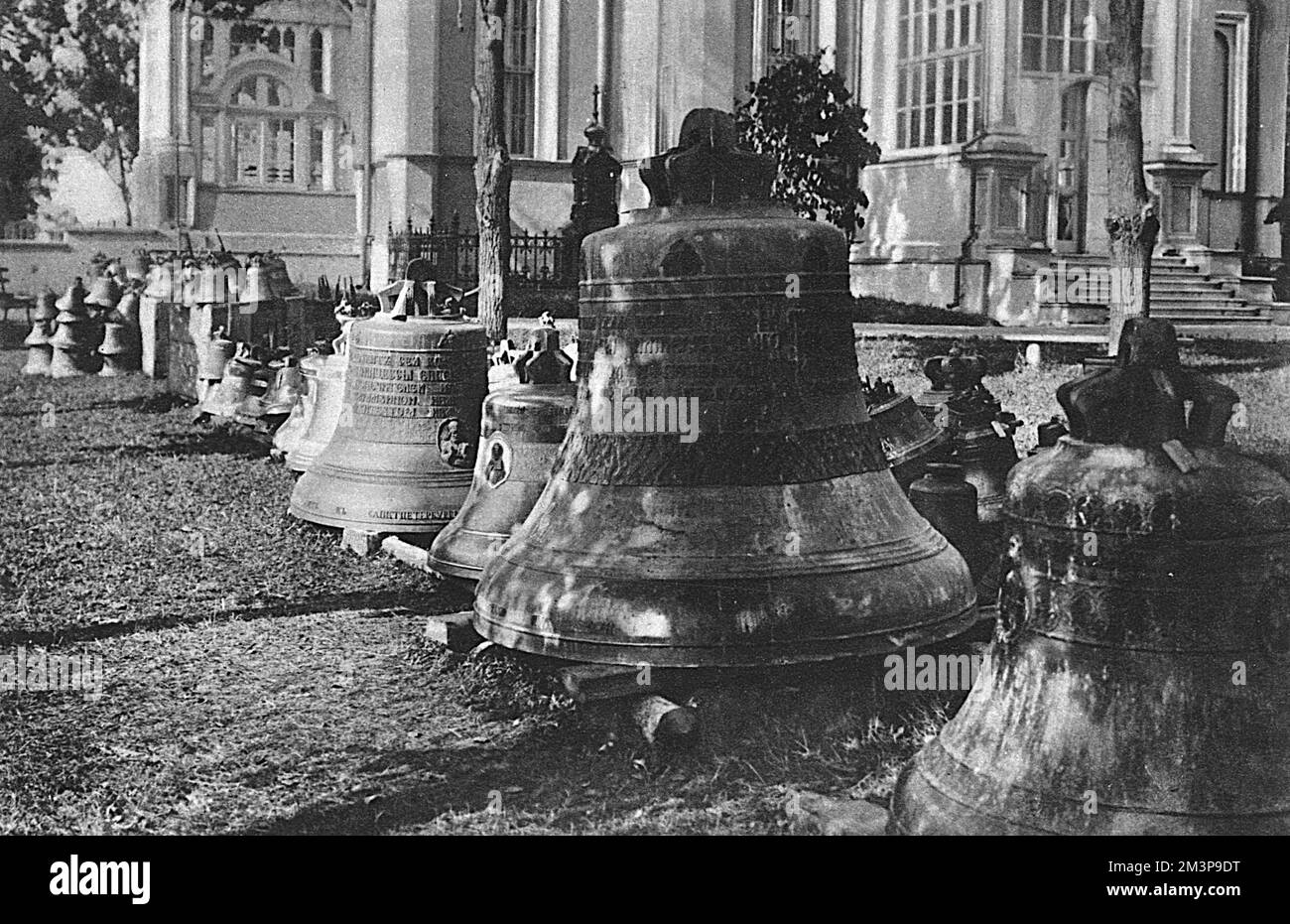 Placed together for safety in the Nikolsky Monastery near Moscow, some of the 300 Russian church bells removed to prevent invading Germans re-using them as metal for shells. Some of the bells are ornamental in design and decoration, showing medallions of priests and bishops in bas relief.     Date: 1915 Stock Photo