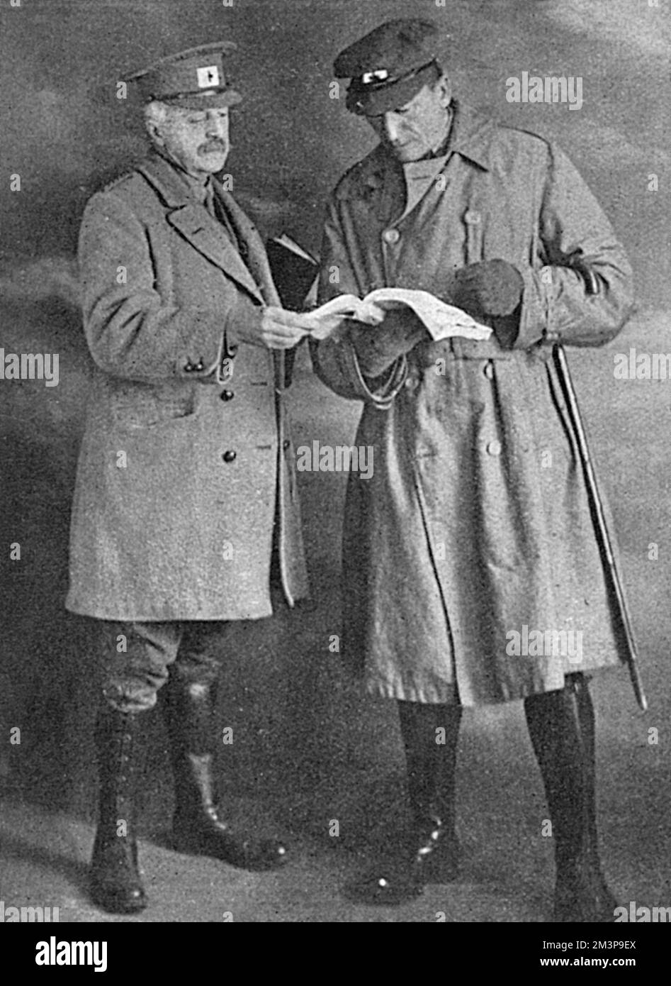 Algernon Henry Blackwood (1869-1951), English author and playwright, particularly known for his supernatural fiction and ghost stories, pictured here on the right with the Punch artist and comic illustrator, Alfred Taylor.  The Tatler reports that Blackwood was working with the Red Cross at Rouen as a searcher for missing men.  The Oxford Dictionary of National Biography does not mention this episode in Blackwood's life, but does note that he worked for British intelligence as an undercover agent in Switzerland during some of the war.     Date: 1918 Stock Photo
