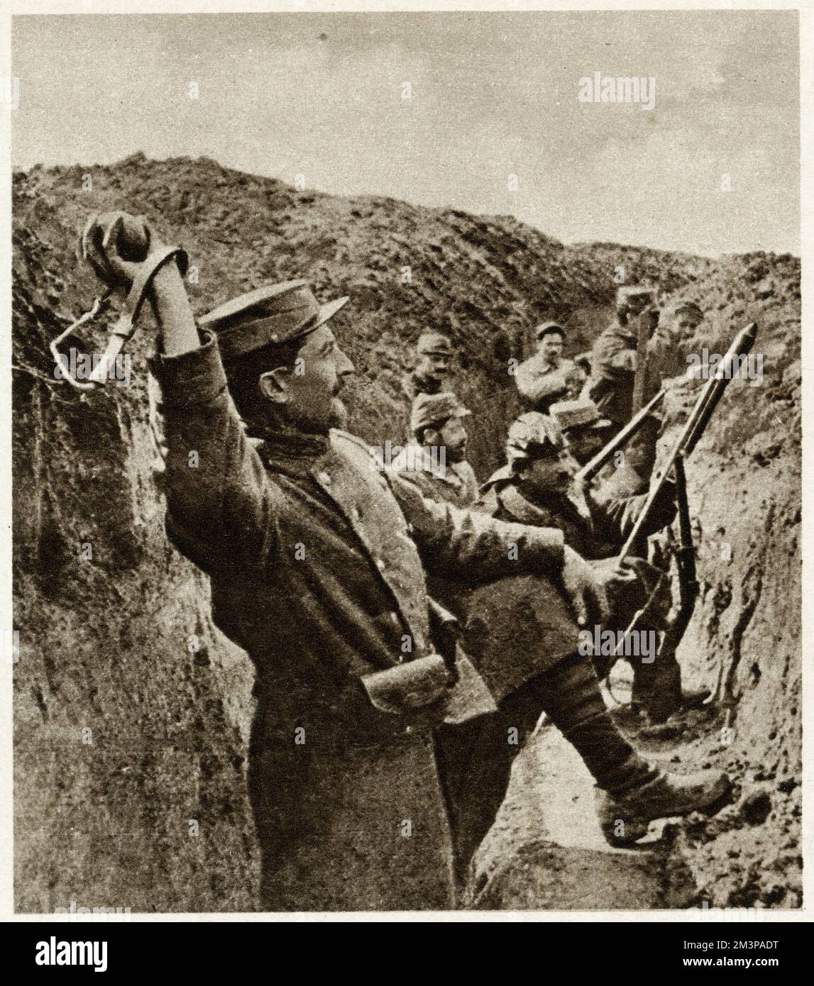 French bracelet grenade, which hooked around the thrower's wrist with a strap or thong.  Innocuous while in the soldier??s hand, the jerk as the grenade extends the strap and flies free by means of swivel-hook pulls out a catch in the bomb and starts the fuse burning.     Date: 1915 Stock Photo
