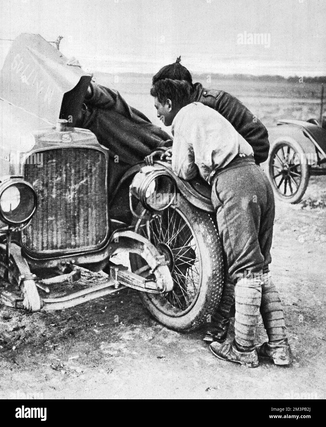 Manipuris from the Burmah border assisting behind the lines: exploring a motor-car on the Western Front during the First World War.     Date: 1917 Stock Photo