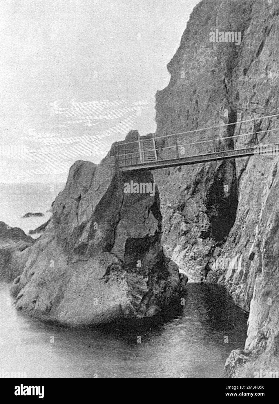 The Gobbins cliff path in Islandmagee, County Antrim, Northern Ireland : the entrance to the first cave of 'Seven Sisters' and the end of the pathway as of 1902 when the first section of the path opened. The scenic coastal path was built by engineer Berkeley Deane Wise.     Date: 1902 Stock Photo