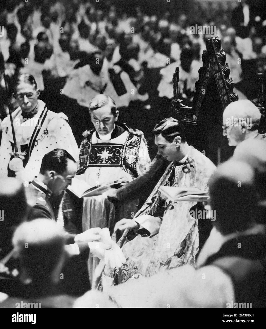 The Earl of Lincoln, as Deputy of the Lord of the Manor of Worksop, handing over a glove, for King George VI (1895-1952) to wear during his coronation, 1937. George VI's coronation took place on 12th May 1937 at Westminster Abbey, the date previously intended for his brother Edward VIII's coronation. Stock Photo