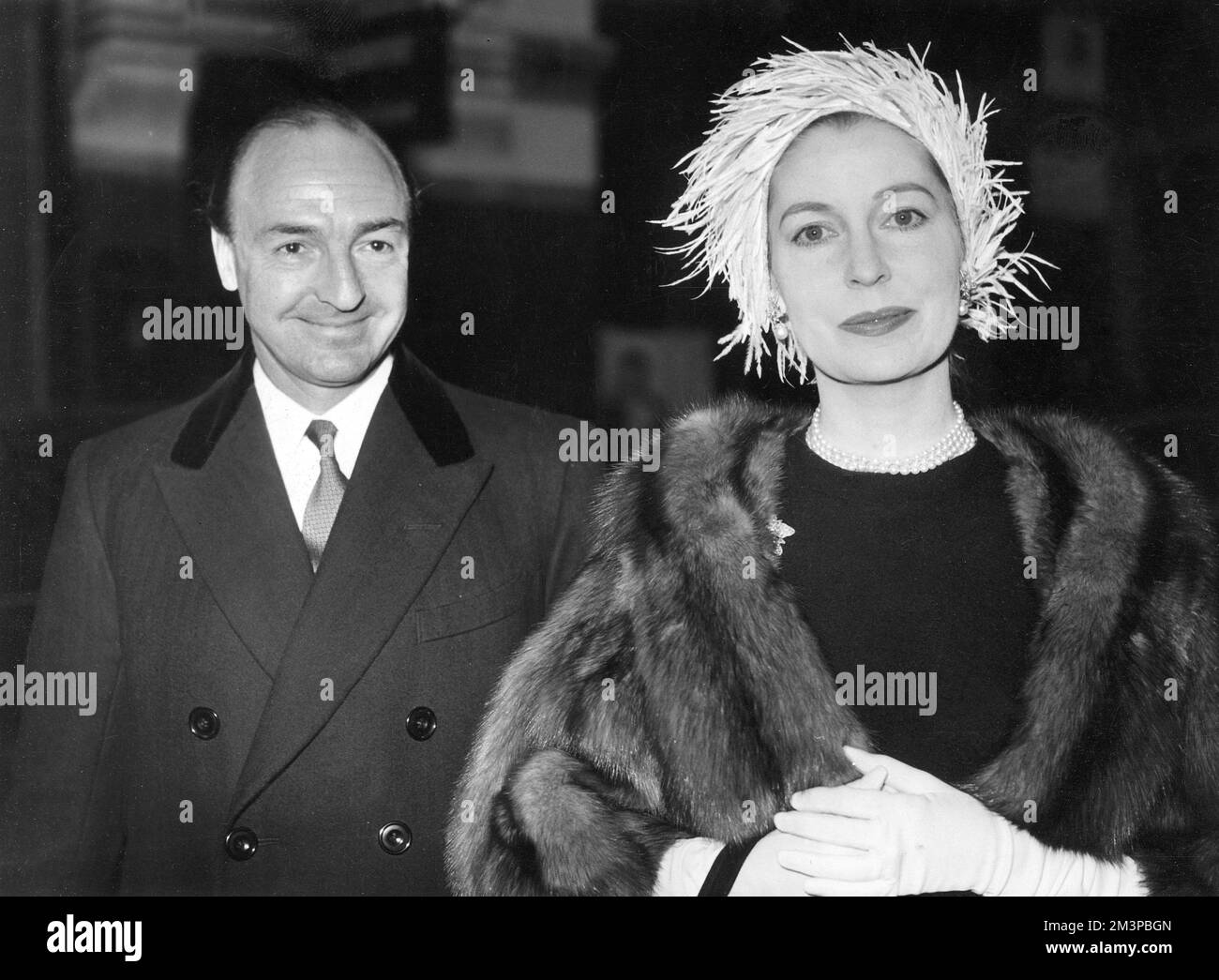 John Dennis Profumo (1915-2006), British conservative politician and Secretary of State for War in Harold Macmillan's government until his involvement with call girl Christine Keeler (and his subsequent denial of any impropriety) during the infamous Profumo Affair led to his resignation.  Pictured with his wife, actress Valerie Hobson (1917-1998).     Date: c.1960 Stock Photo