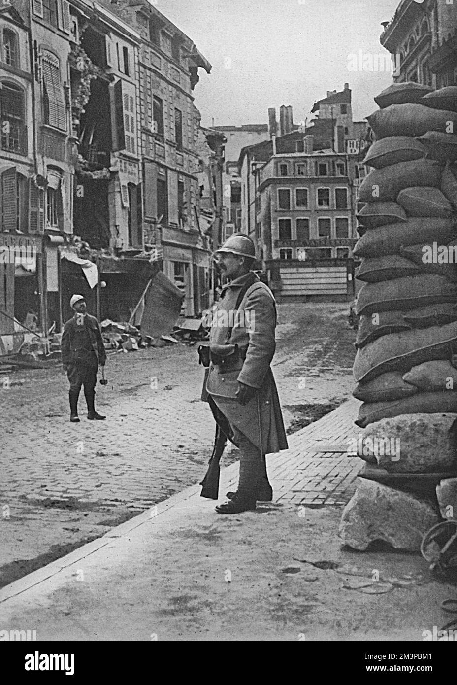 Appearance of the town of Verdun after a heavy bombardment by German guns in 1916 in order to force French positions.  The town was evacuated by civilians, deserted by all but its garrison of soldiers and firemen.  As can be seen, many of the buildings were sandbagged at their base.     Date: 1916 Stock Photo