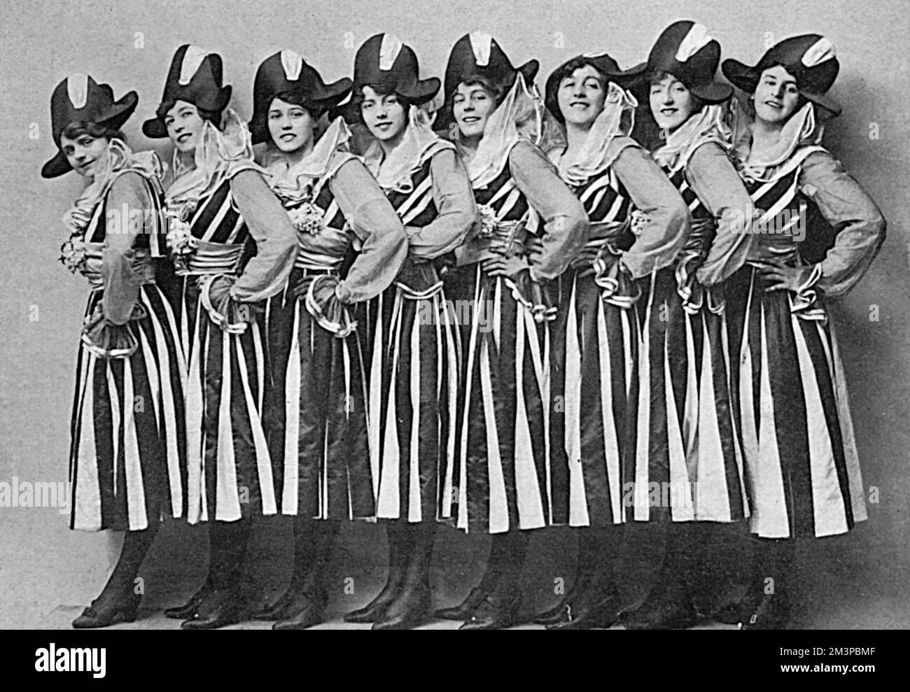 Miss Ena Grossmith and her able associates from Kensington forming a merry band of amateur hospital entertainers dressed in black and white in order to entertain the wounded and convalescent with song and witty dialogue during the First World War.       Date: 1916 Stock Photo