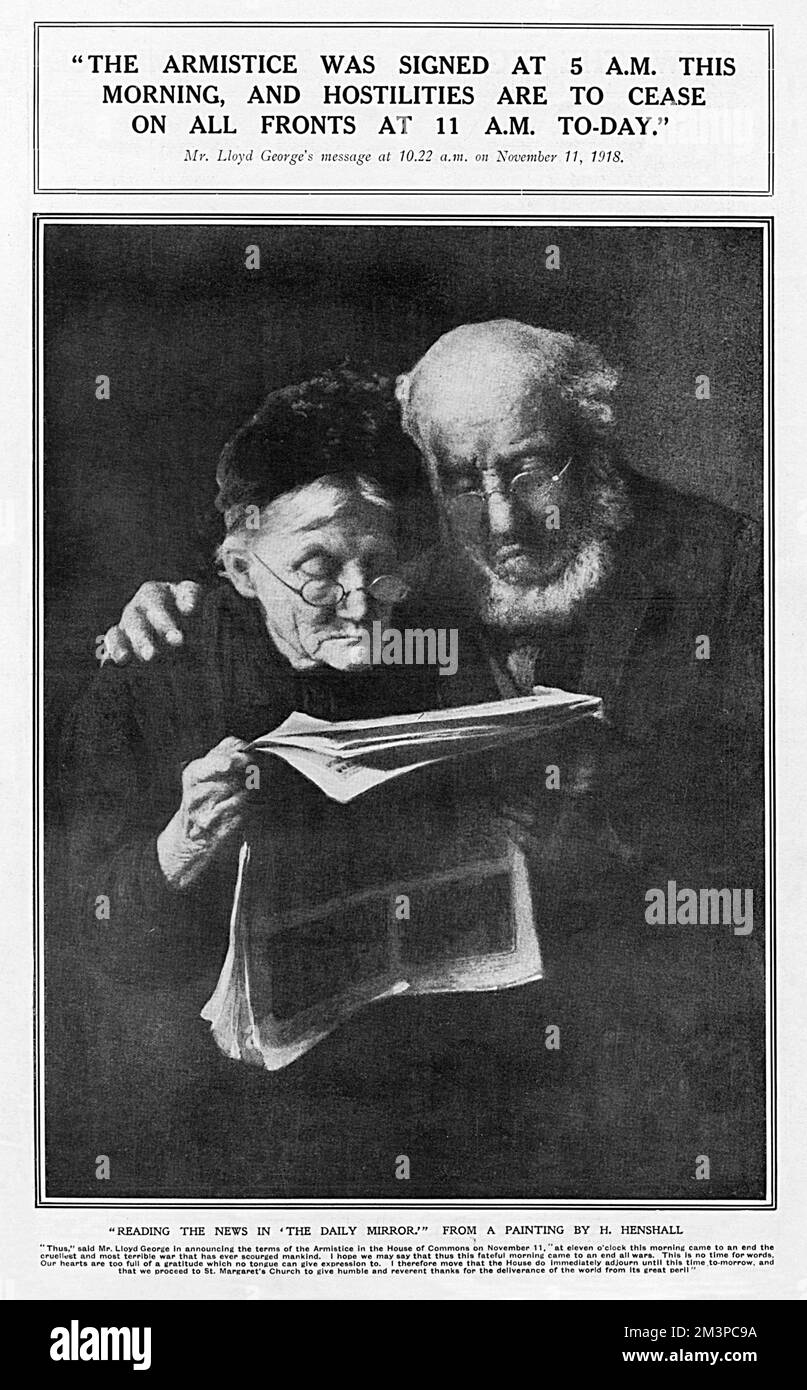 An elderly couple peering at the Daily Mirror newspaper to read news of the Armistice, signed at 5 am on 11th November 1918, bringing an end to the hostilities of the First World War.       Date: 1918 Stock Photo