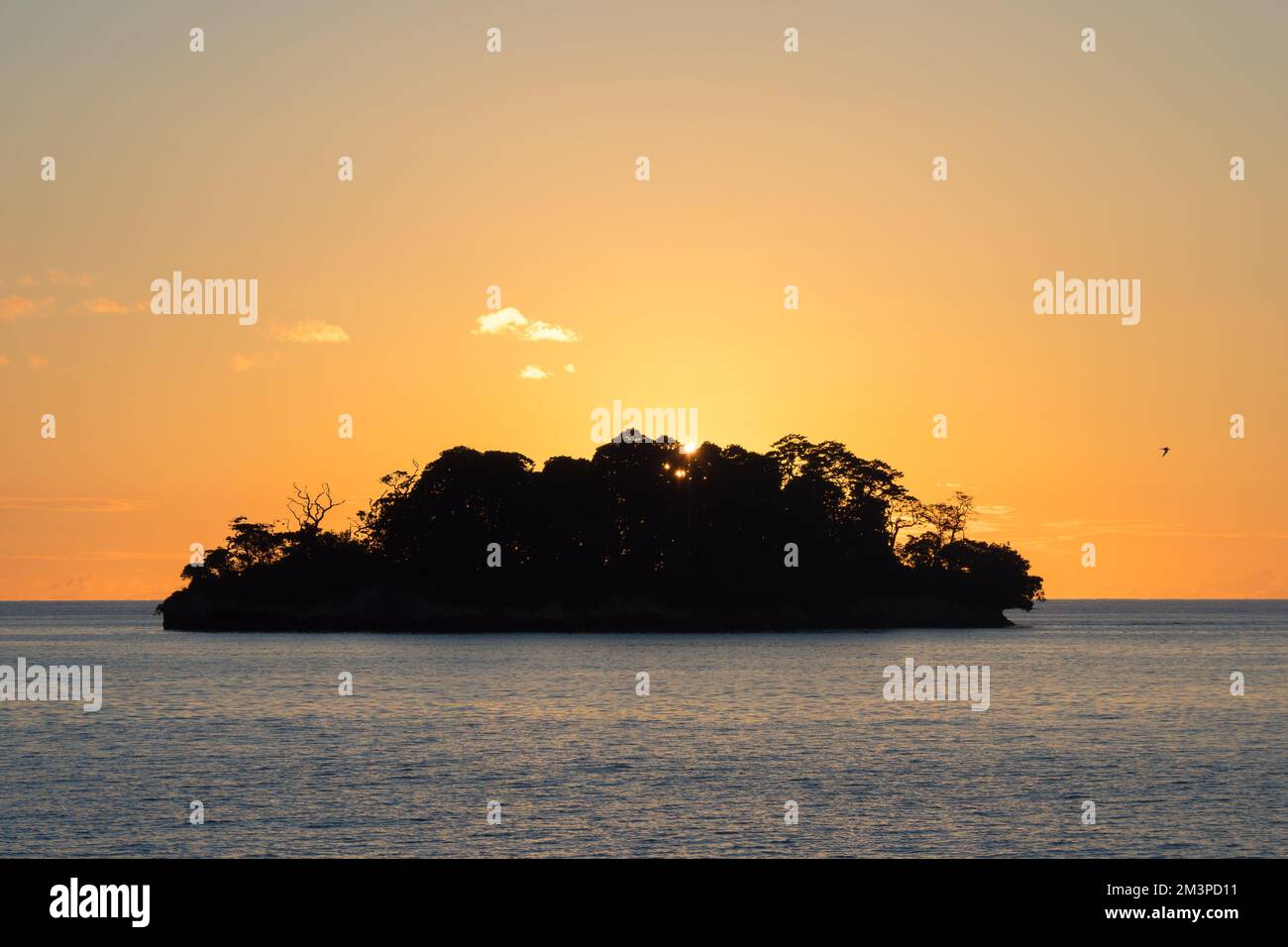 Sunrise over beautiful tropical island in the south Pacific in Papua Stock Photo