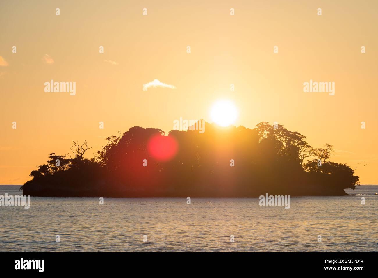 Sunrise over beautiful tropical island in the south Pacific in Papua Stock Photo
