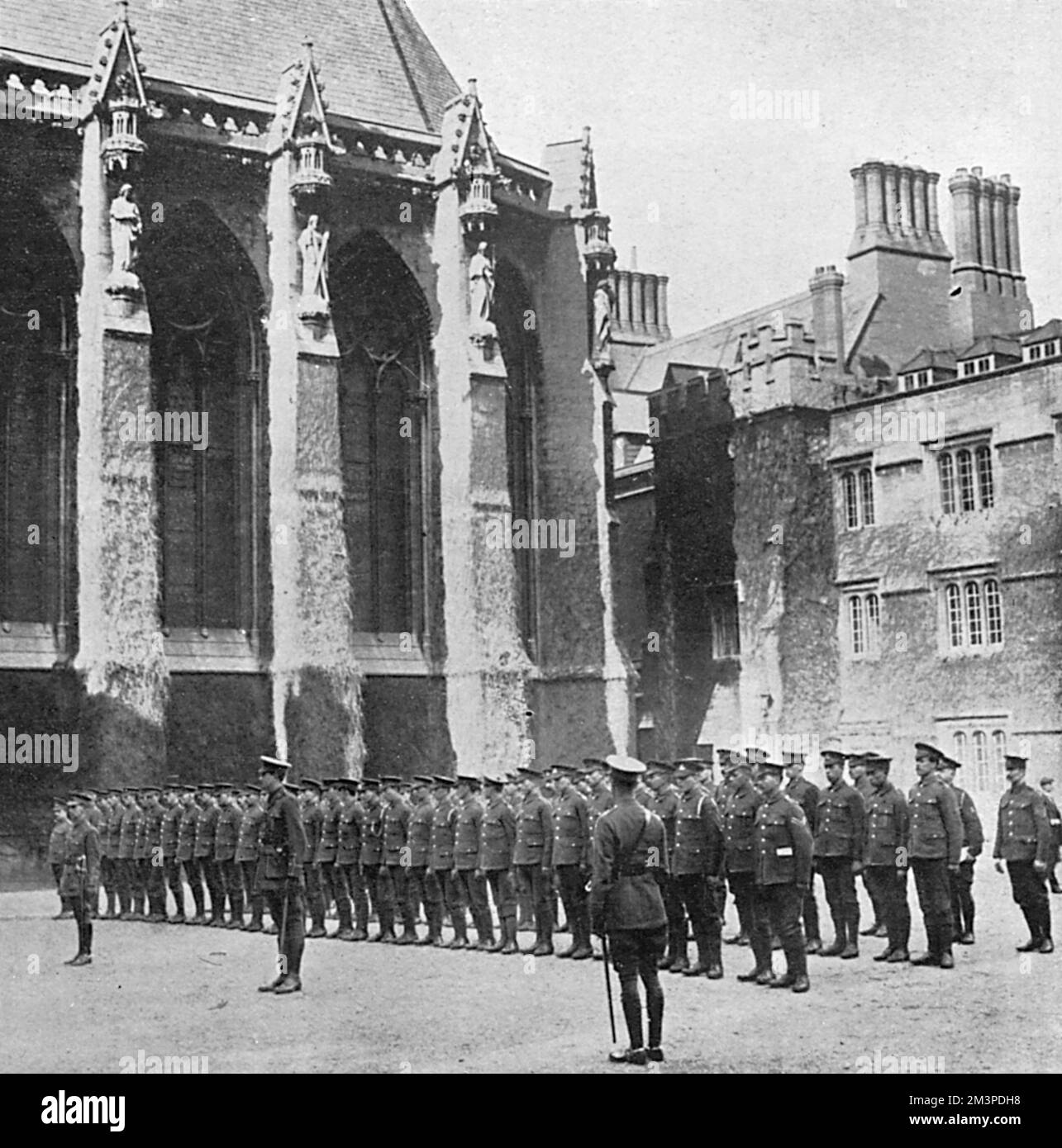 Members of the Officers' Training Corps at Oxford University drilling in a college quadrangle.       Date: 1915 Stock Photo