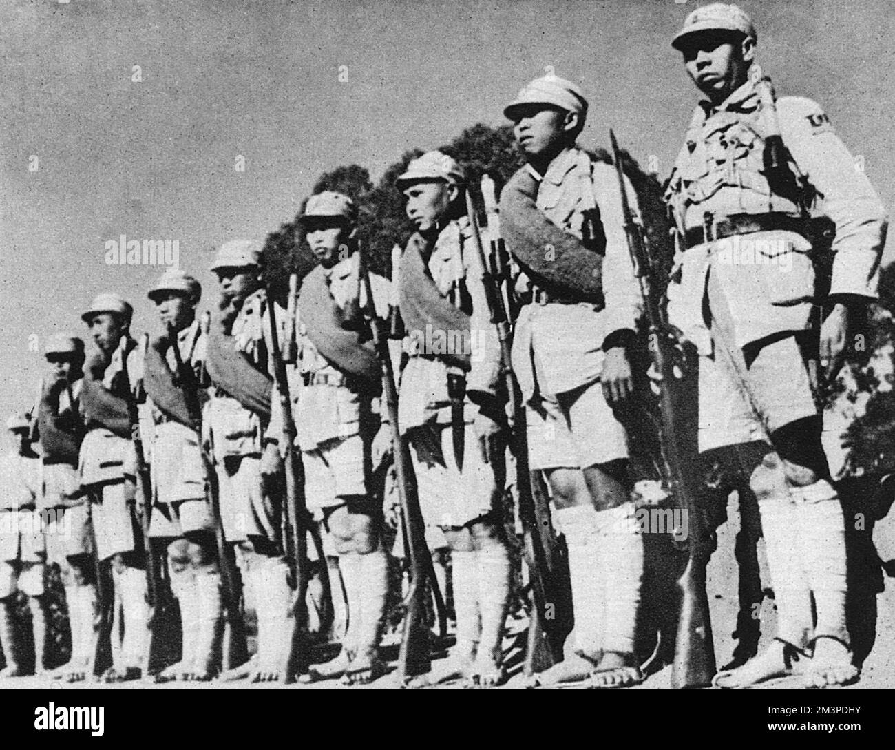 A Chinese suicide squad in 1942, who, equipped with hand-grenades besides rifles, did great damage to enemy Japanese troops in the Chinese victory at Changsha, World War Two.     Date: 1942 Stock Photo