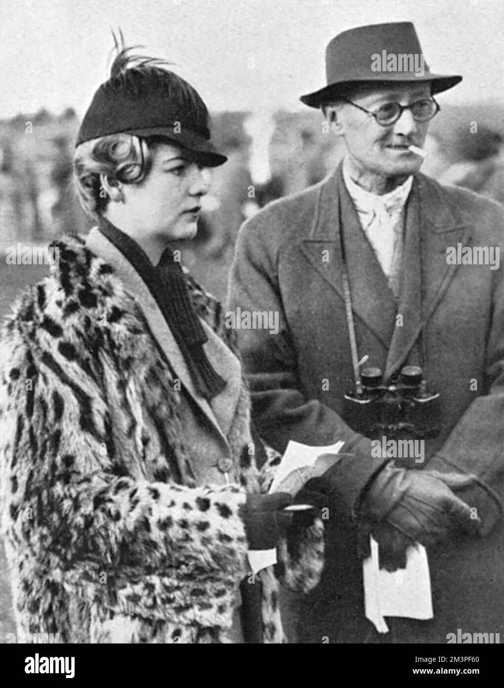 Deborah Mitford (1920-2014), later Duchess of Devonshire, pictured at the age of sixteen (nearly seventeen) in 1937 at Cheltenham races with Mr Dixon.  Debo was the youngest of the infamous six Mitford sisters, daughters of Lord and Lady Redesdale.       Date: 1937 Stock Photo
