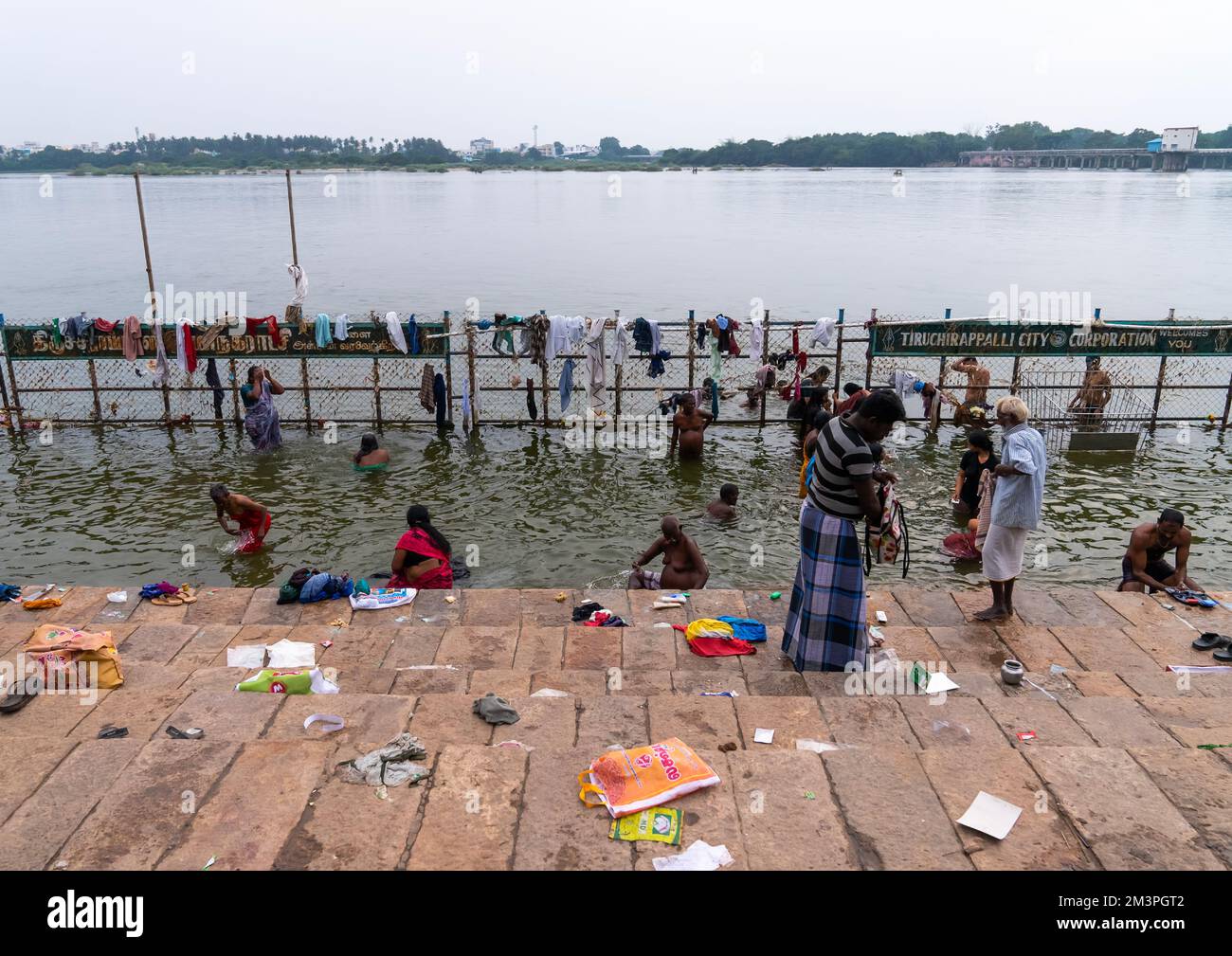 Indian people bathing in holy river, Tamil Nadu, Tiruchirappalli, India Stock Photo