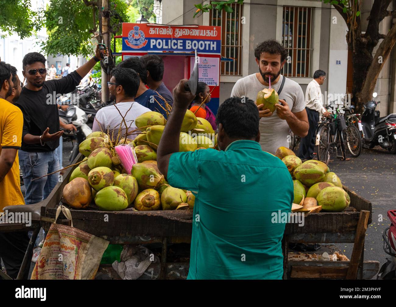 Coconuts juice for sale on market stall, Pondicherry, Puducherry, India Stock Photo