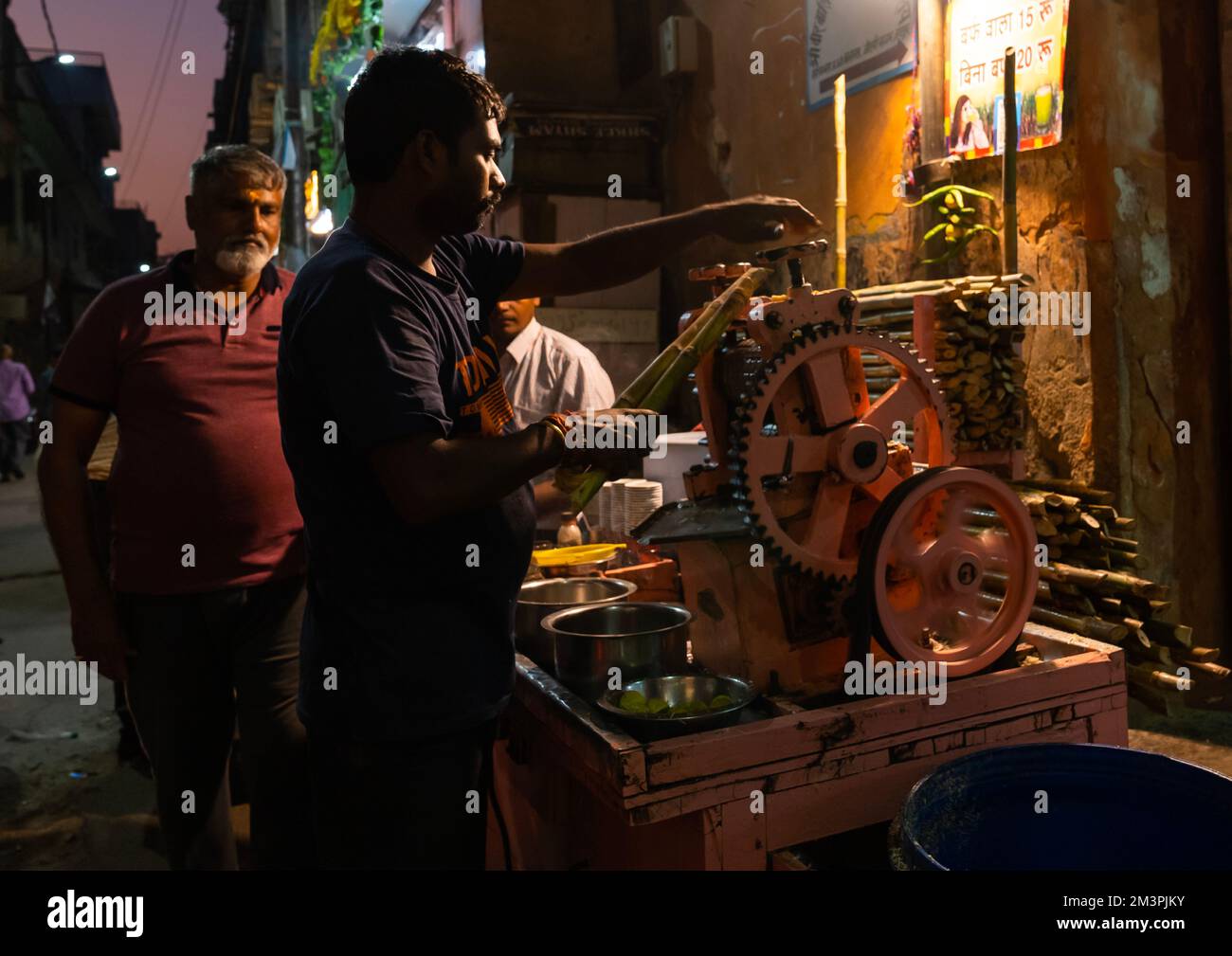 Indian man making a fresh cane juice, Rajasthan, Jaipur, India Stock Photo