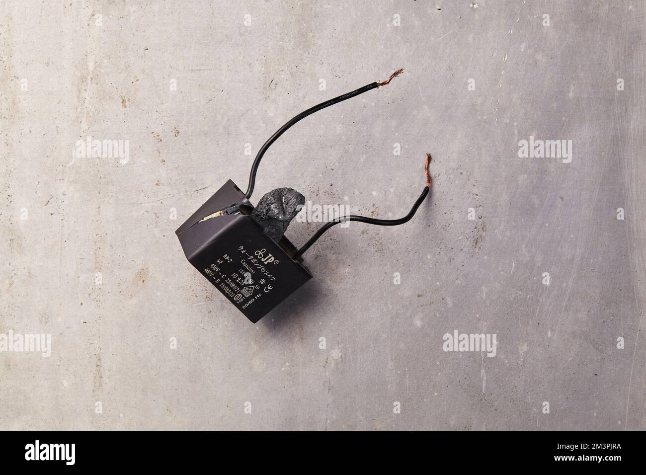 A Capacitor that failed due to overheating Stock Photo Alamy