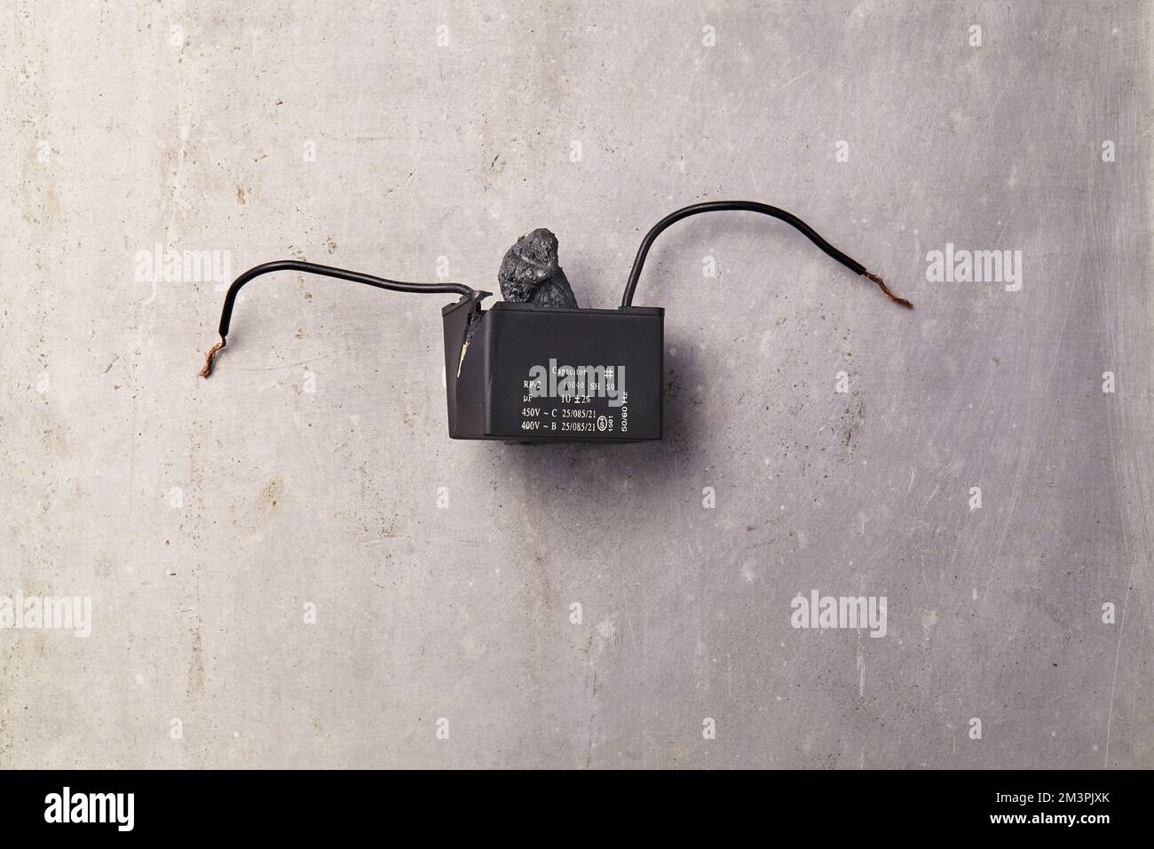a broken capacitor on a grey floor Stock Photo Circuit Diagram