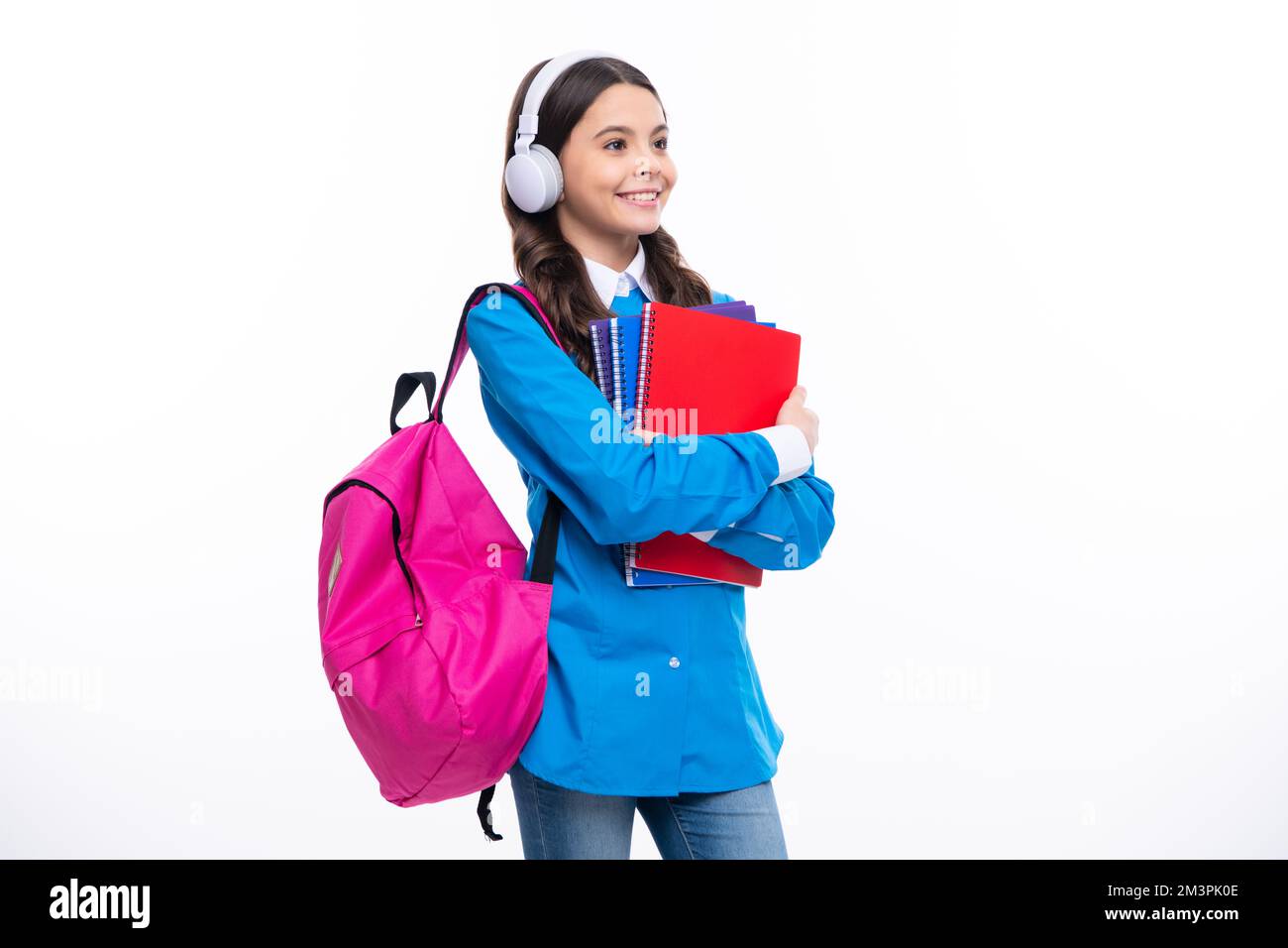 School girl, teenage student in headphones and books on isolated studio ...