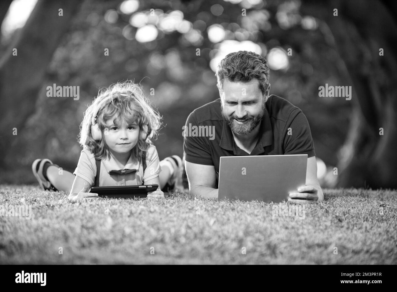 happy boy listen music in headphones. webinar video lesson. online education on laptop. Stock Photo