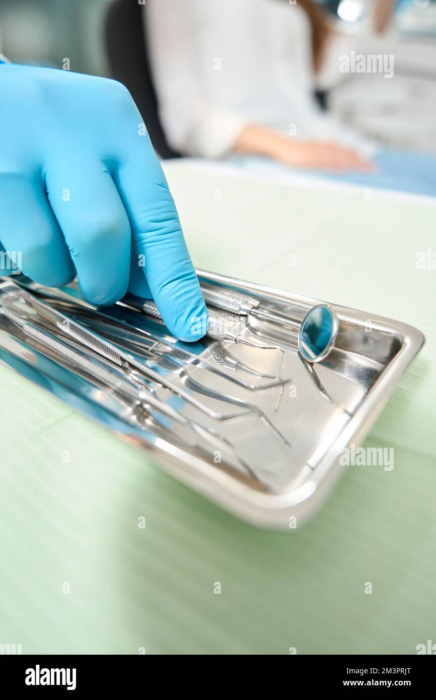Doctor is choosing tools for patient examination Stock Photo - Alamy