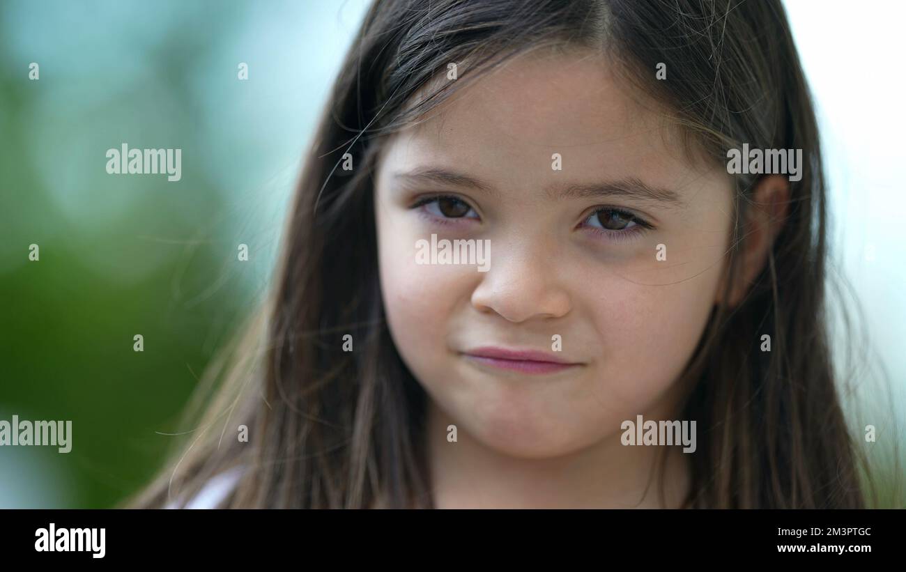 Cute Little Girl Portrait Pensive Child Closeup Standing Outside Stock cute-little-girl-portrait-pensive-child-closeup-standing-outside-stock