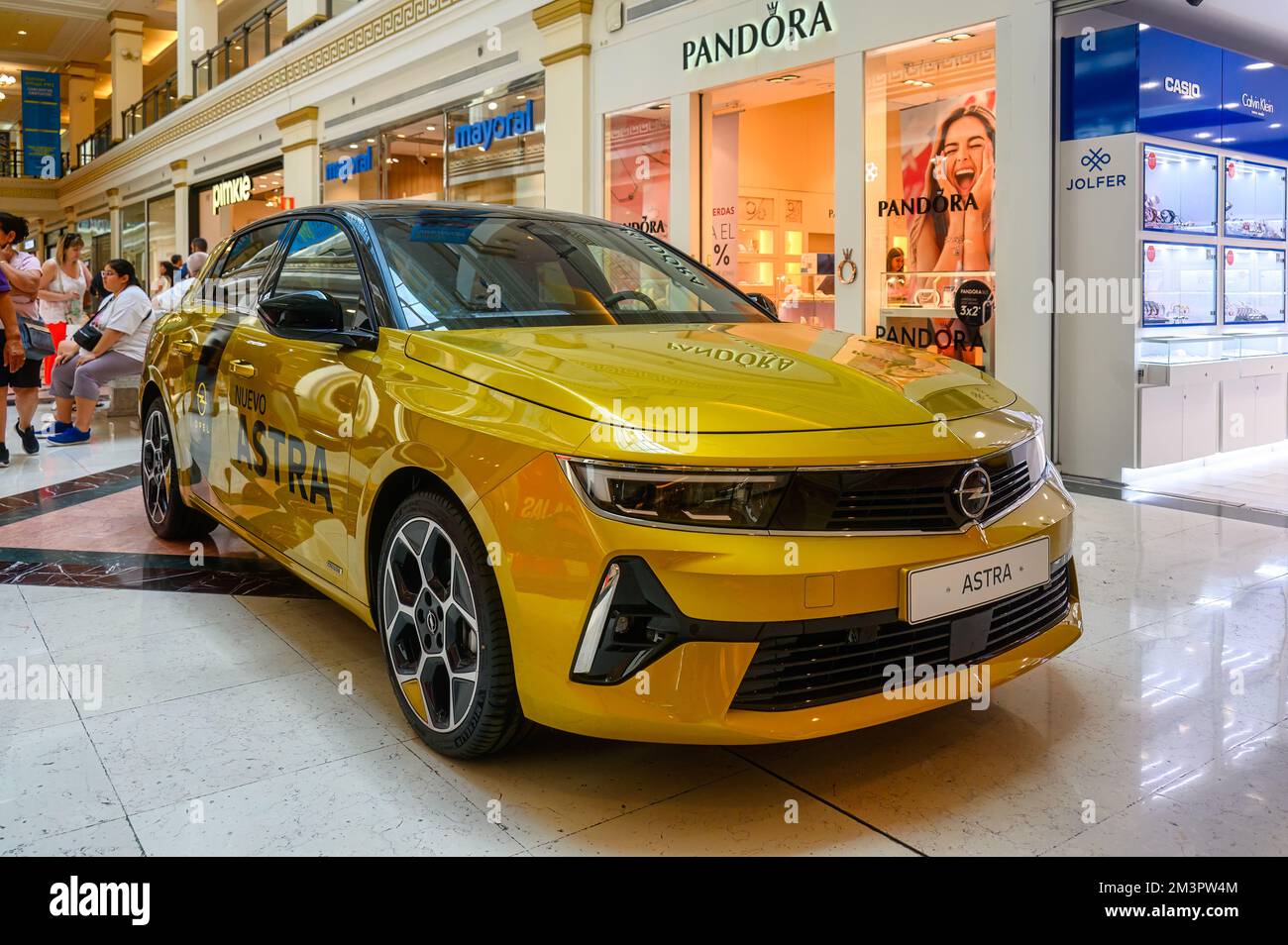 Plaza Mar 2 shopping mall in Alicante, Spain: A new Opel Astra car is being promoted in a corridor of the building interior Stock Photo