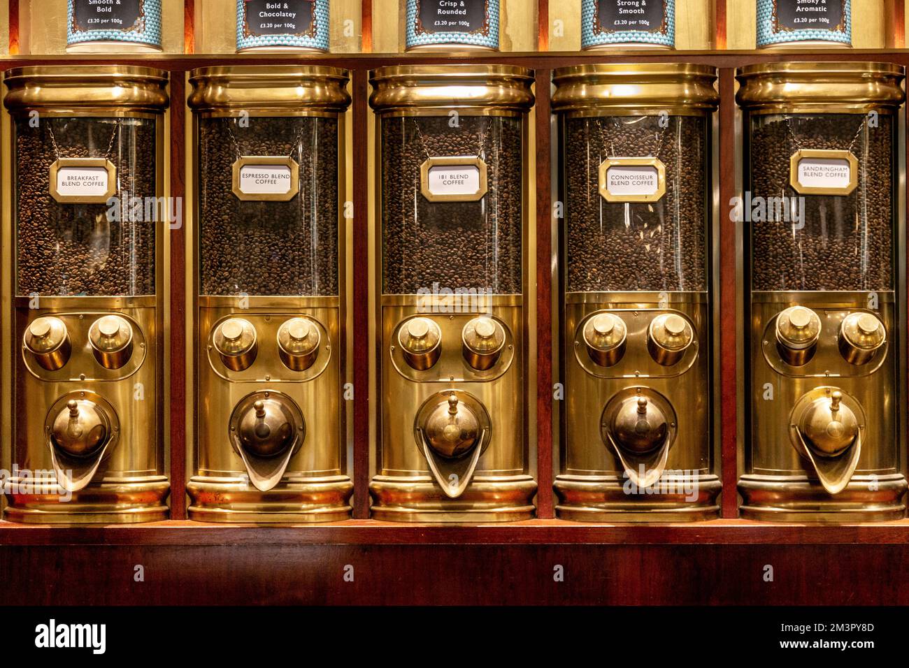 Gold coffee bean dispensers at Fortnum & Mason, Piccadilly, London, UK Stock Photo