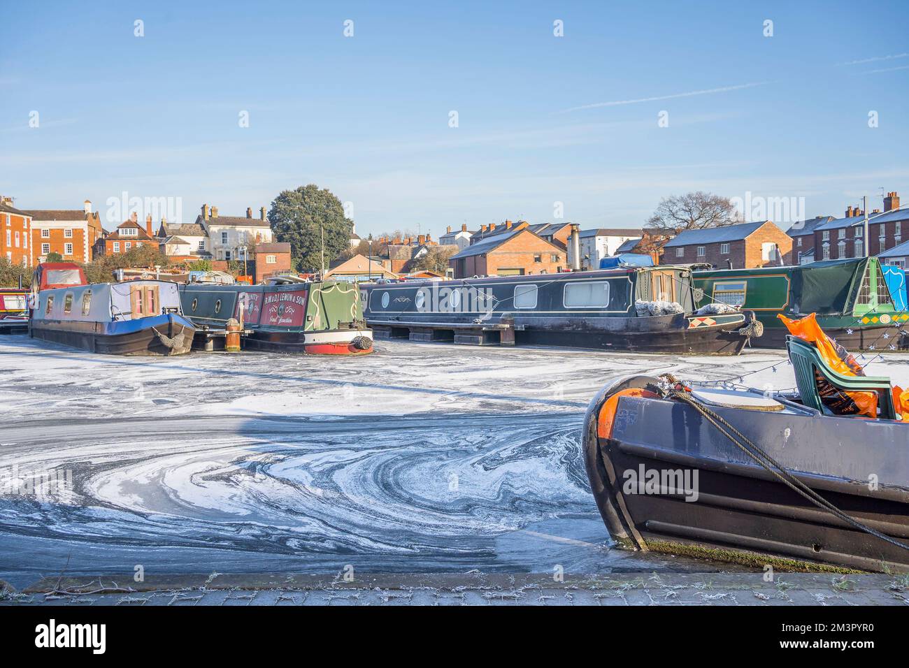 Stourport-on-Severn, UK. 16th December, 2022. UK weather: ice everywhere as freezing conditions persist in the Midlands. Water in the basin marina is frozen solid in Stourport-on-Severn and these Worcestershire boats are going nowhere today! Credit: Lee Hudson/Alamy Live News Stock Photo