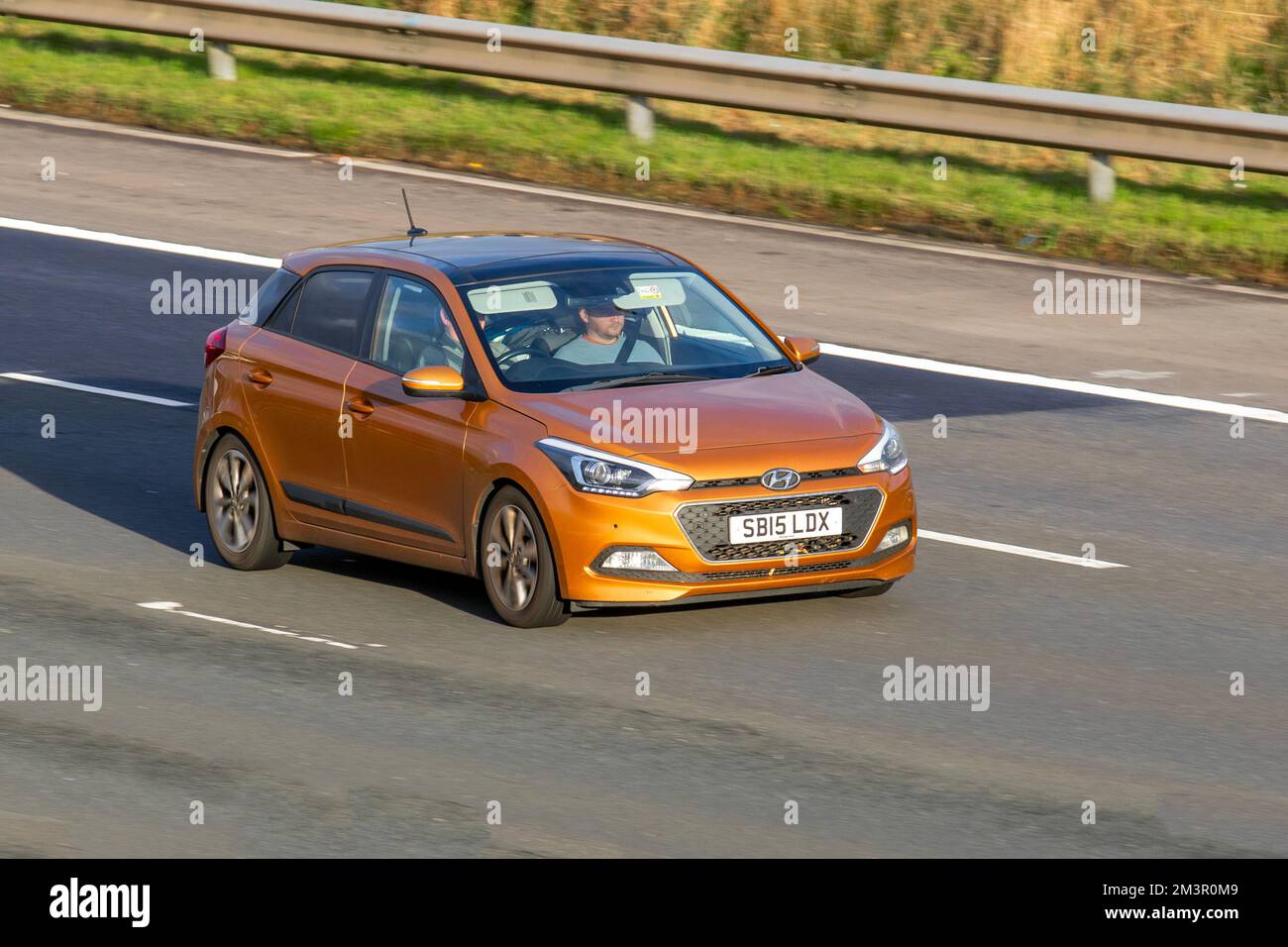 2015 Orange HYUNDAI 120 XRDI SE 1396cc Diesel 6 speed manual; travelling on the M6 motorway, UK Stock Photo