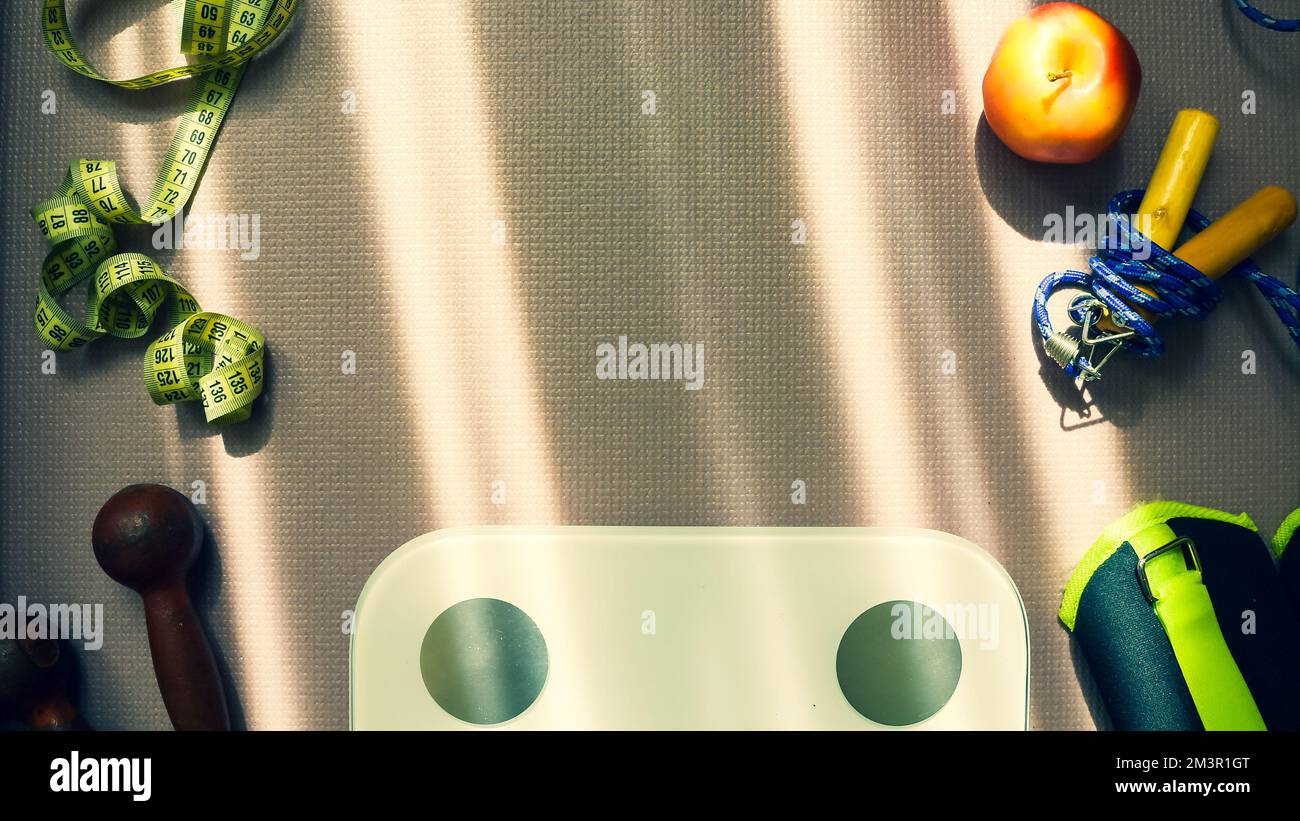 Top view Healthy female flat lay runners set up and fitness equipments