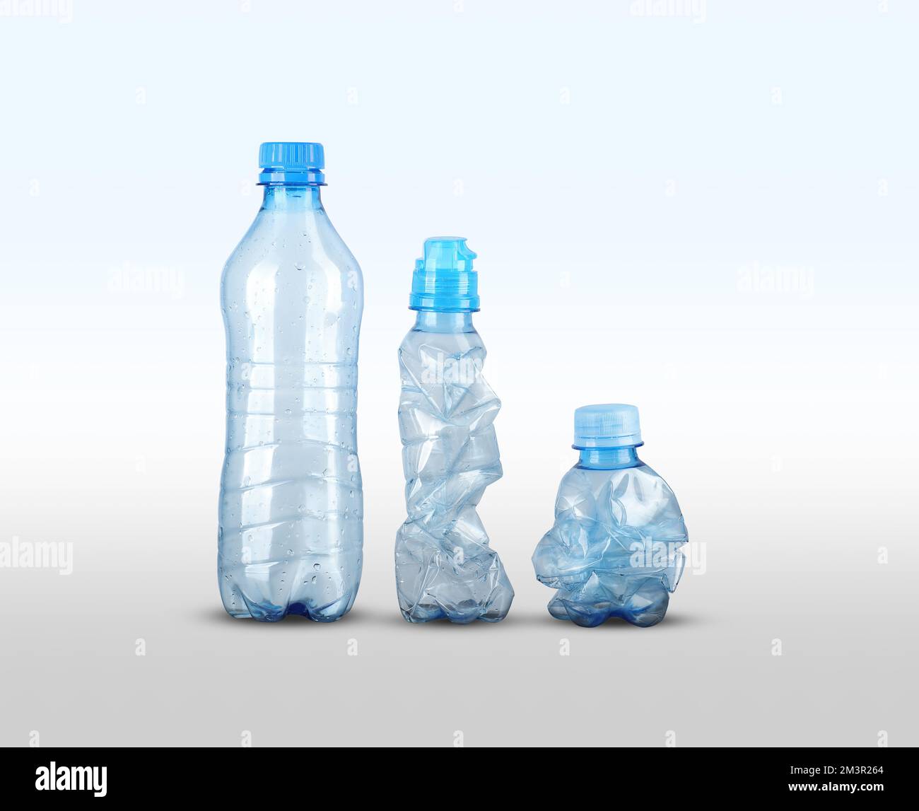 three empty plastic bottles on a white background Stock Photo - Alamy