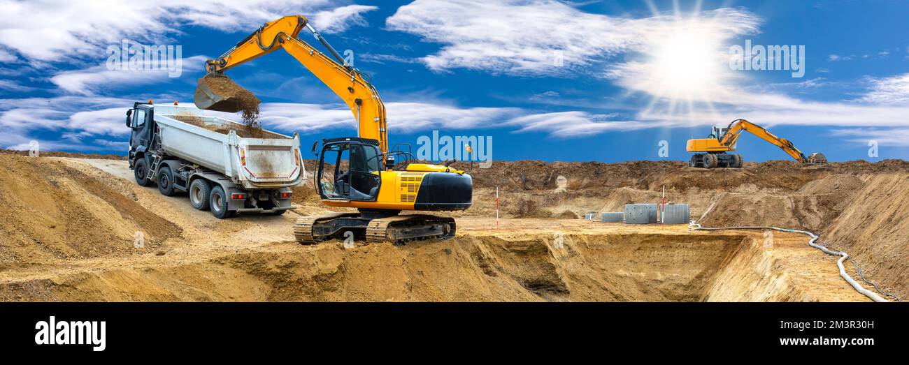 excavator ist working and digging at construction site Stock Photo