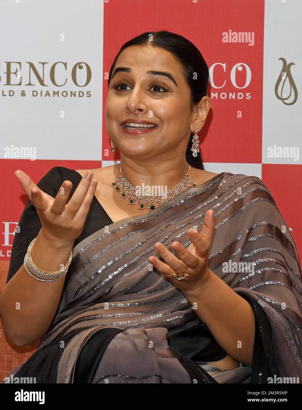 Mumbai, India. 16th Dec, 2022. Bollywood actress Vidya Balan reacts during the launch of a gold