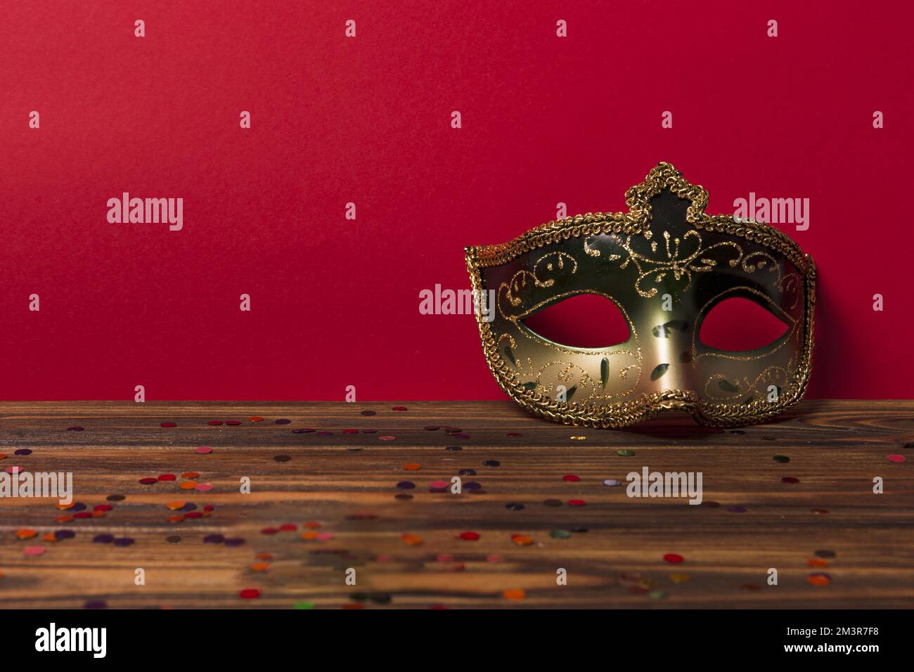 Carnival mask near red wall Stock Photo Alamy
