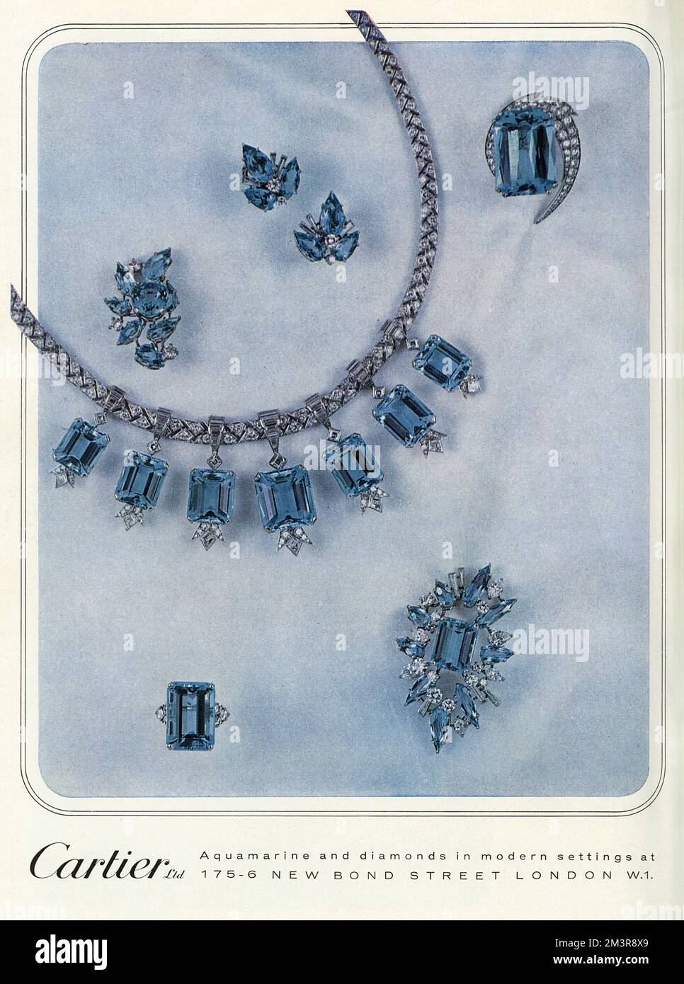 Cartier advertisement featuring aquamarine and diamond pieces in modern settings.       Date: 1965 Stock Photo